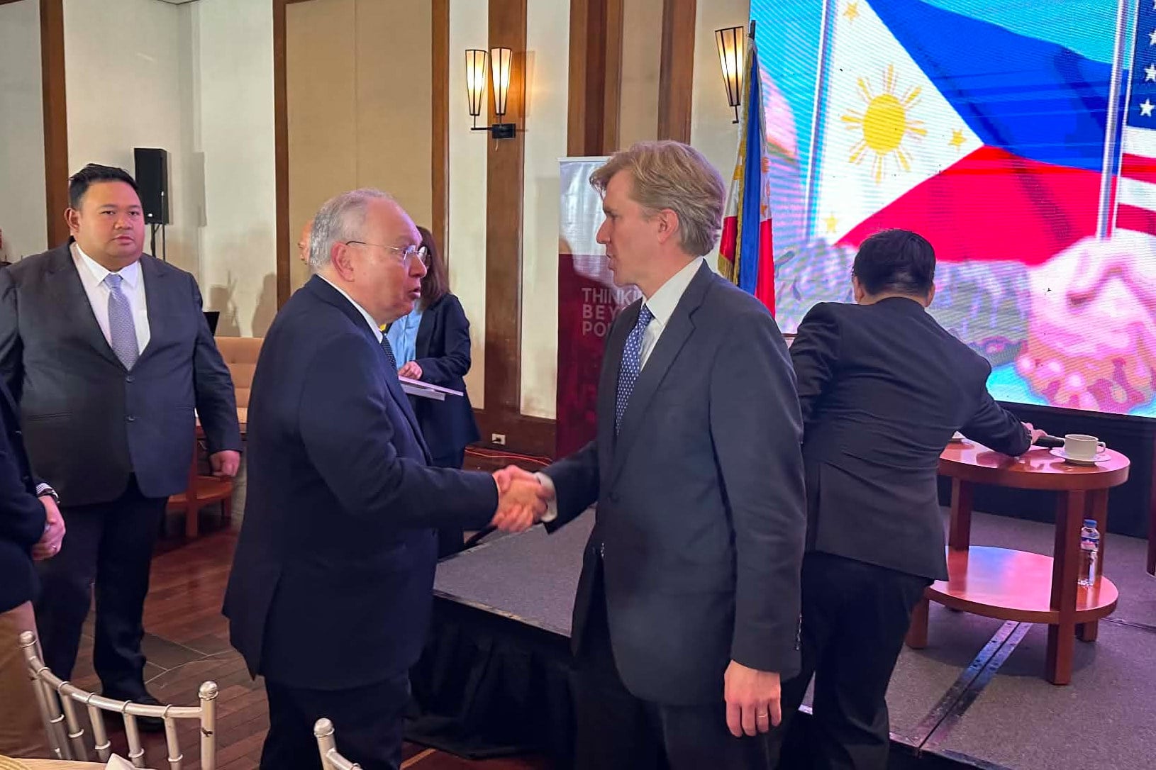 US Undersecretary of Defence for Policy Elbridge Colby (second from right) meets Philippine ambassador to the US Jose Manuel Romualdez at a forum in Manila on August 10. Photo: AP