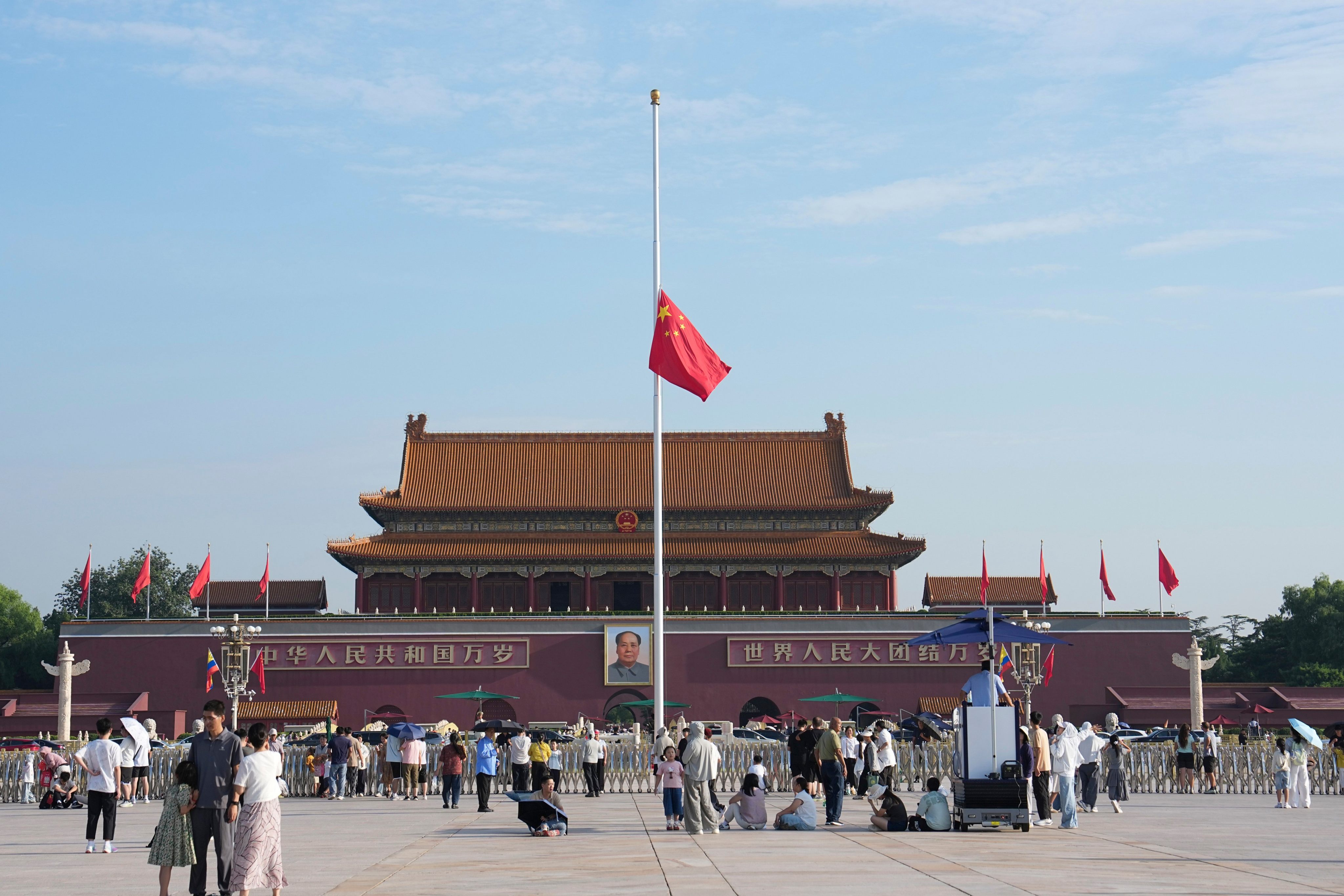 The national flag is lowered to half-mast in Tiananmen Square on Tuesday to mourn former premier Zhu Rongji. Photo: Xinhua