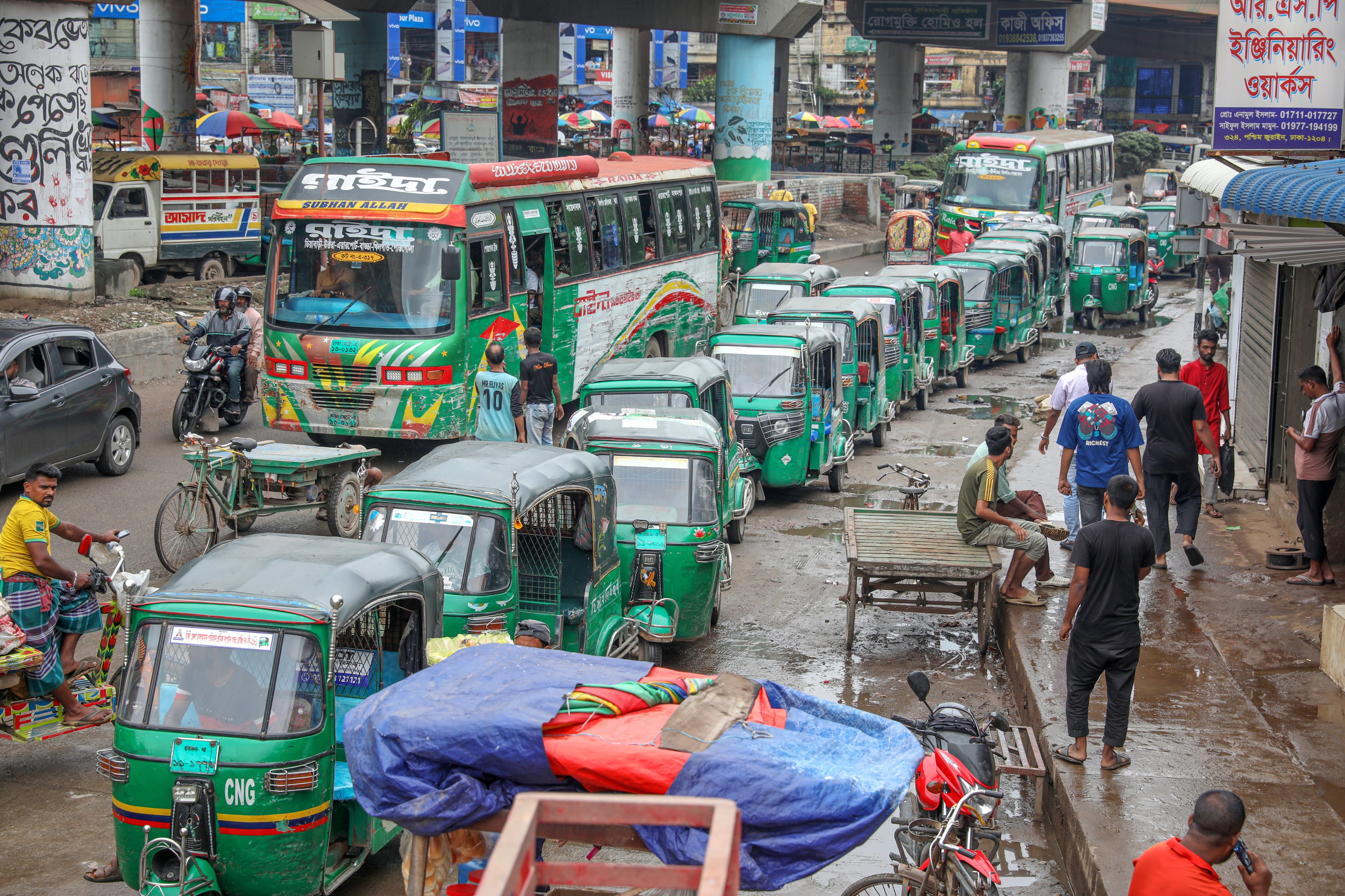 Auto-rickshaws that run on compressed natural gas queue up to refuel at a filling station in Dhaka on Monday amid an energy crisis in Bangladesh. Photo: EPA