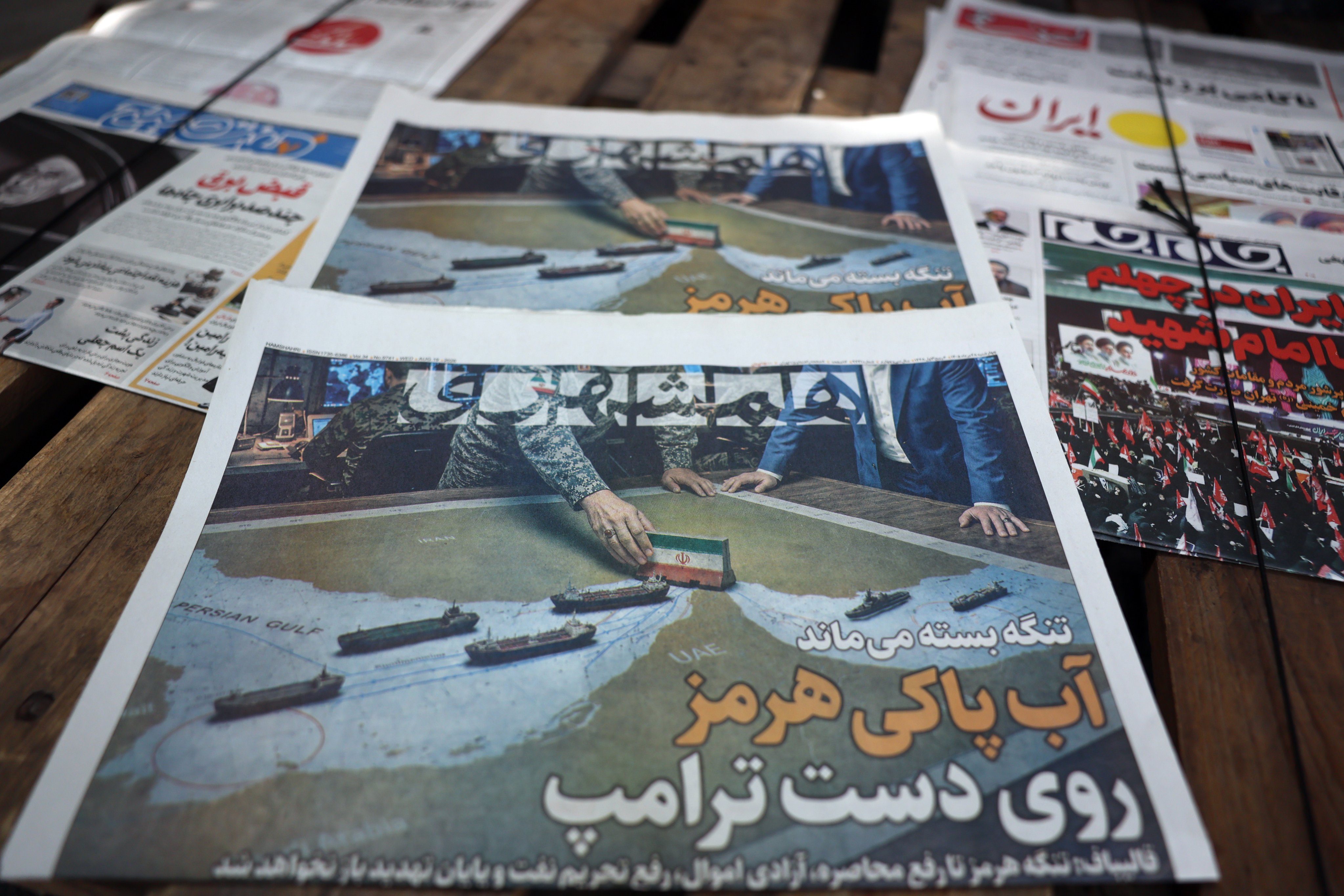 Copies of the Iranian daily newspaper Hamshahri carrying a title that reads in Persian “The Strait of Hormuz remains closed” on display outside a kiosk in Tehran, Iran, on Wednesday. Photo: EPA