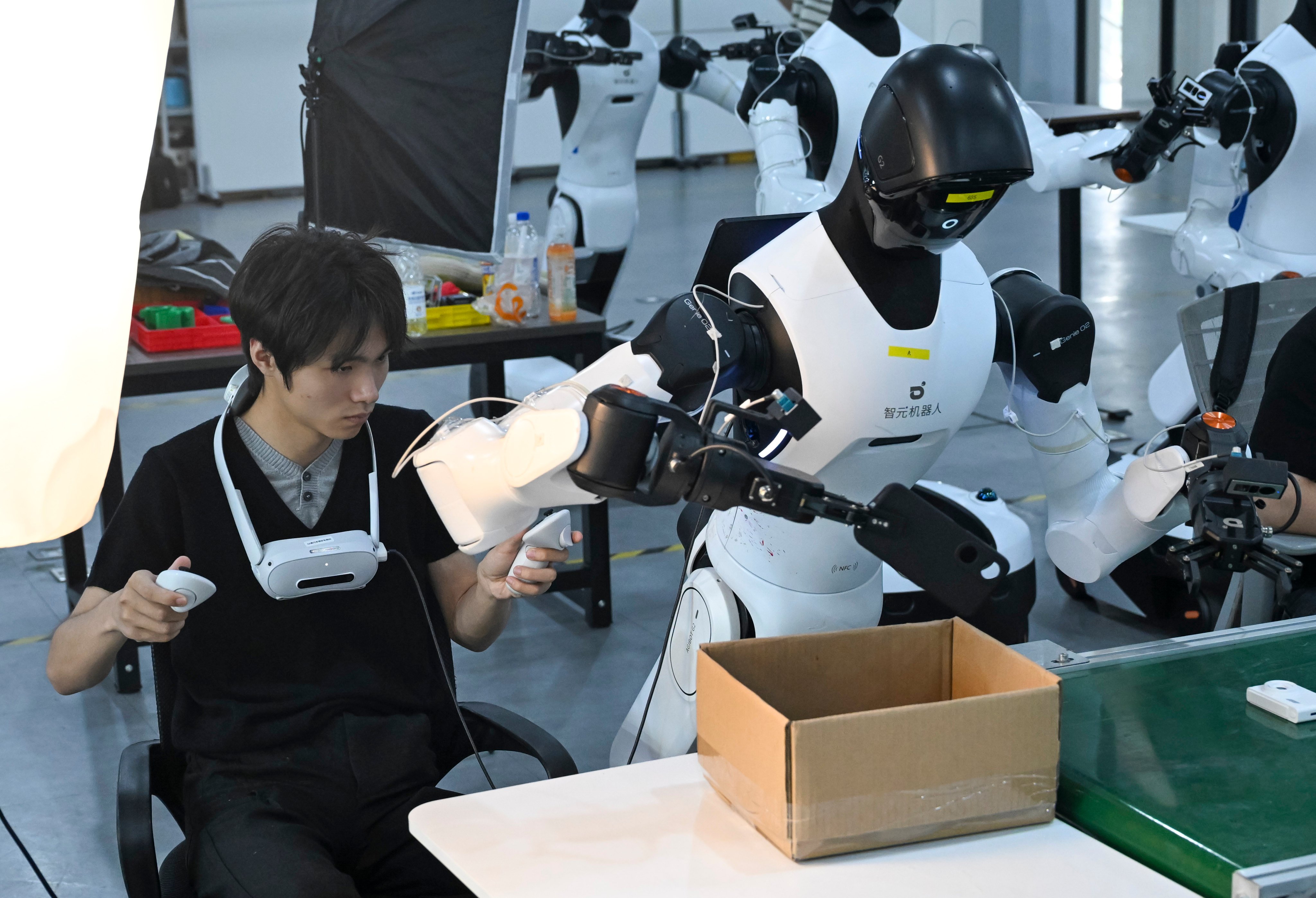 An employee programmes a robot to sort items at Maniformer, a physical AI data service platform, in Shanghai on August 5. Photo: Xinhua