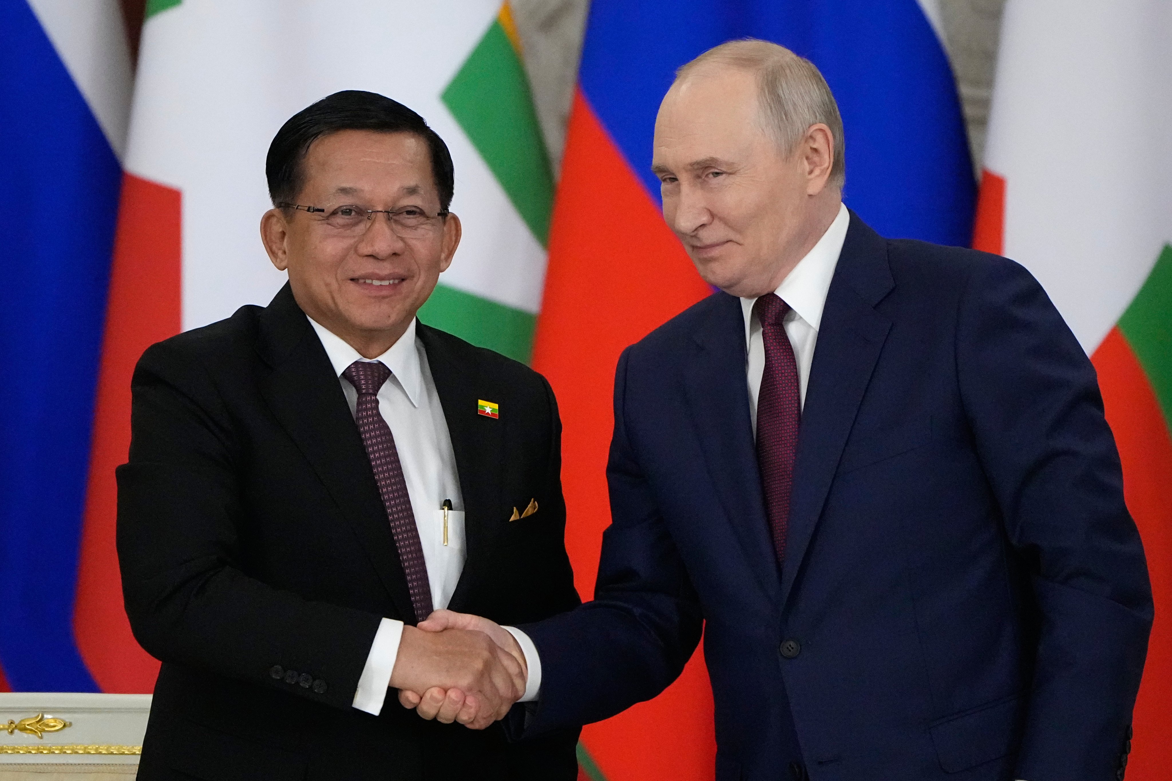 Russian President Vladimir Putin  and Myanmar President Min Aung Hlaing shake hands during their meeting at the Grand Kremlin Palace in Moscow on Tuesday. Photo: EPA