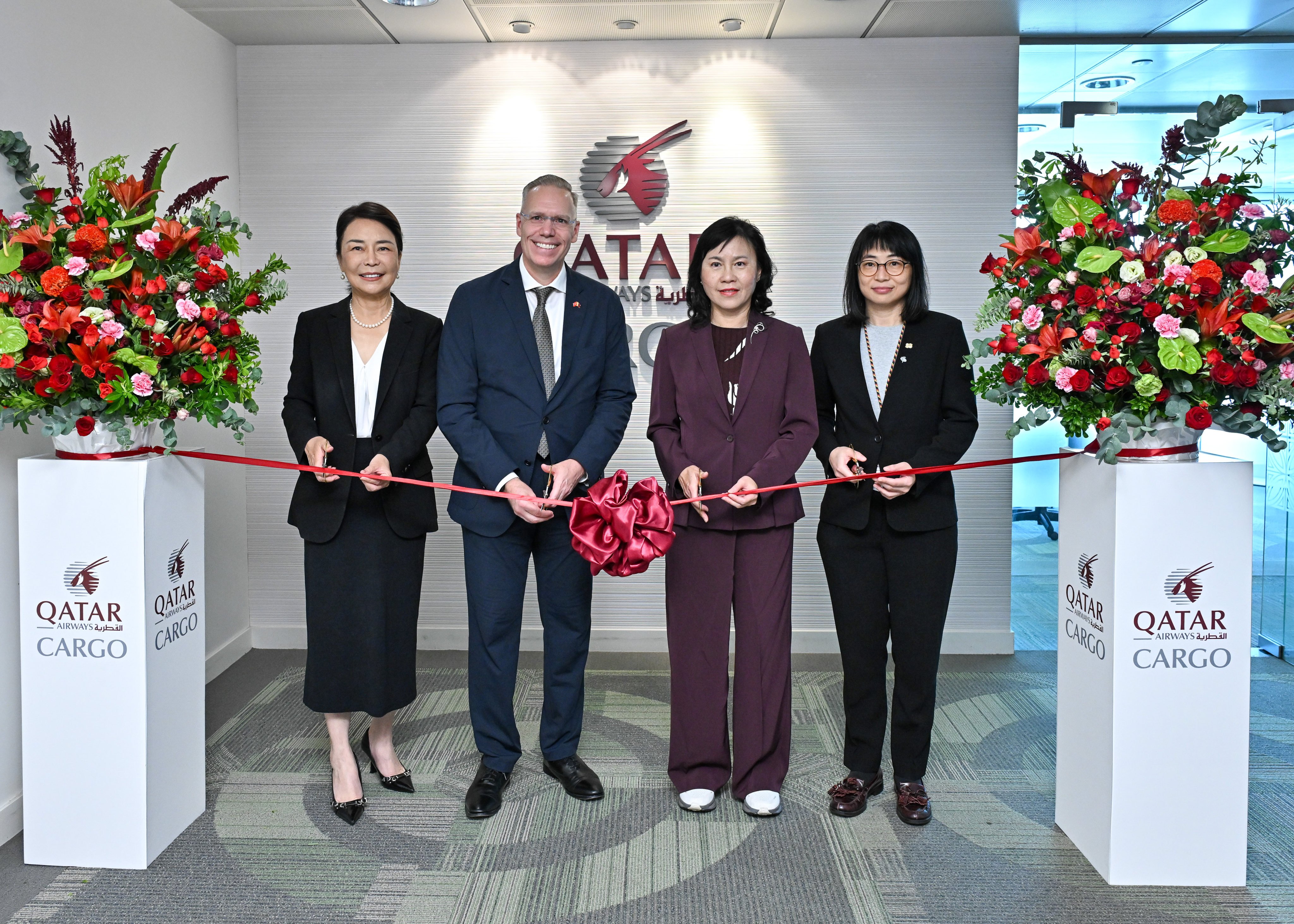 Mable Chan and Eric Wilson (second left) of Qatar Airways Cargo join fellow VIPs for the ribbon-cutting ceremony. Photo: Handout