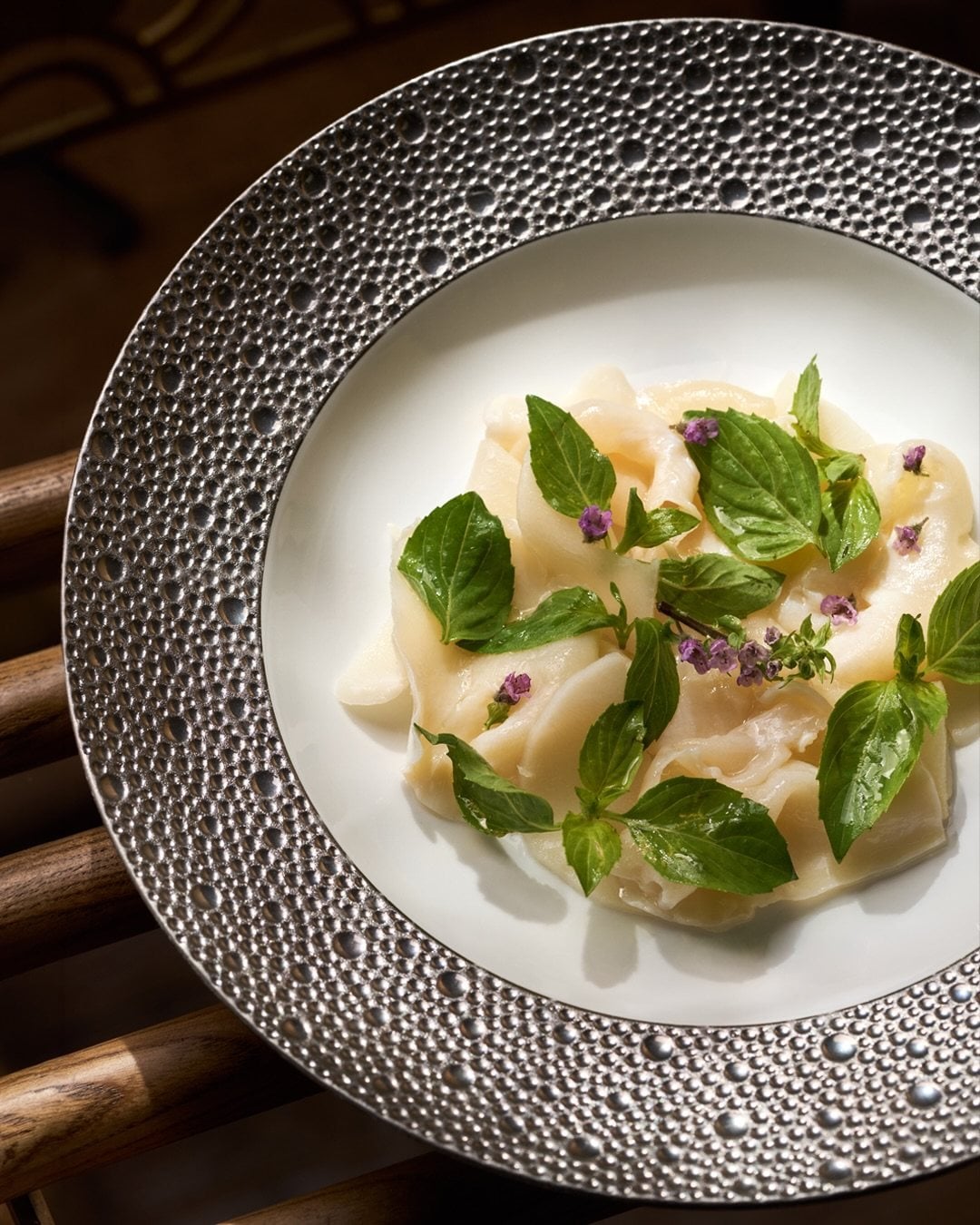 Chilled sea snail and horseshoe bamboo shoots with Thai basil at Yun Jing in Shenzhen. The restaurant was awarded two Michelin stars in the inaugural Michelin Guide Guangzhou & Shenzhen 2026. Photo: Instagram/rafflesshenzhen