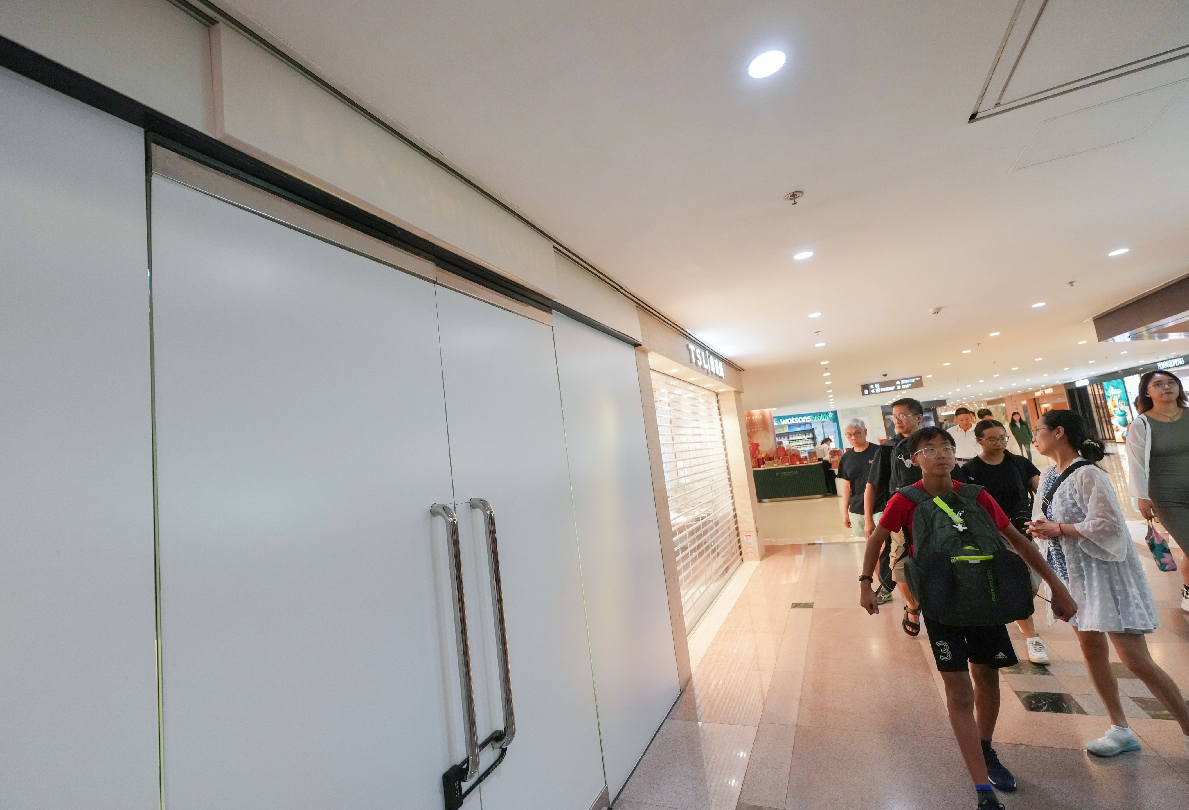 The Lux Boutique outlet at Harbour City has it windows covered and door locked on Thursday. Photo: Karma Lo