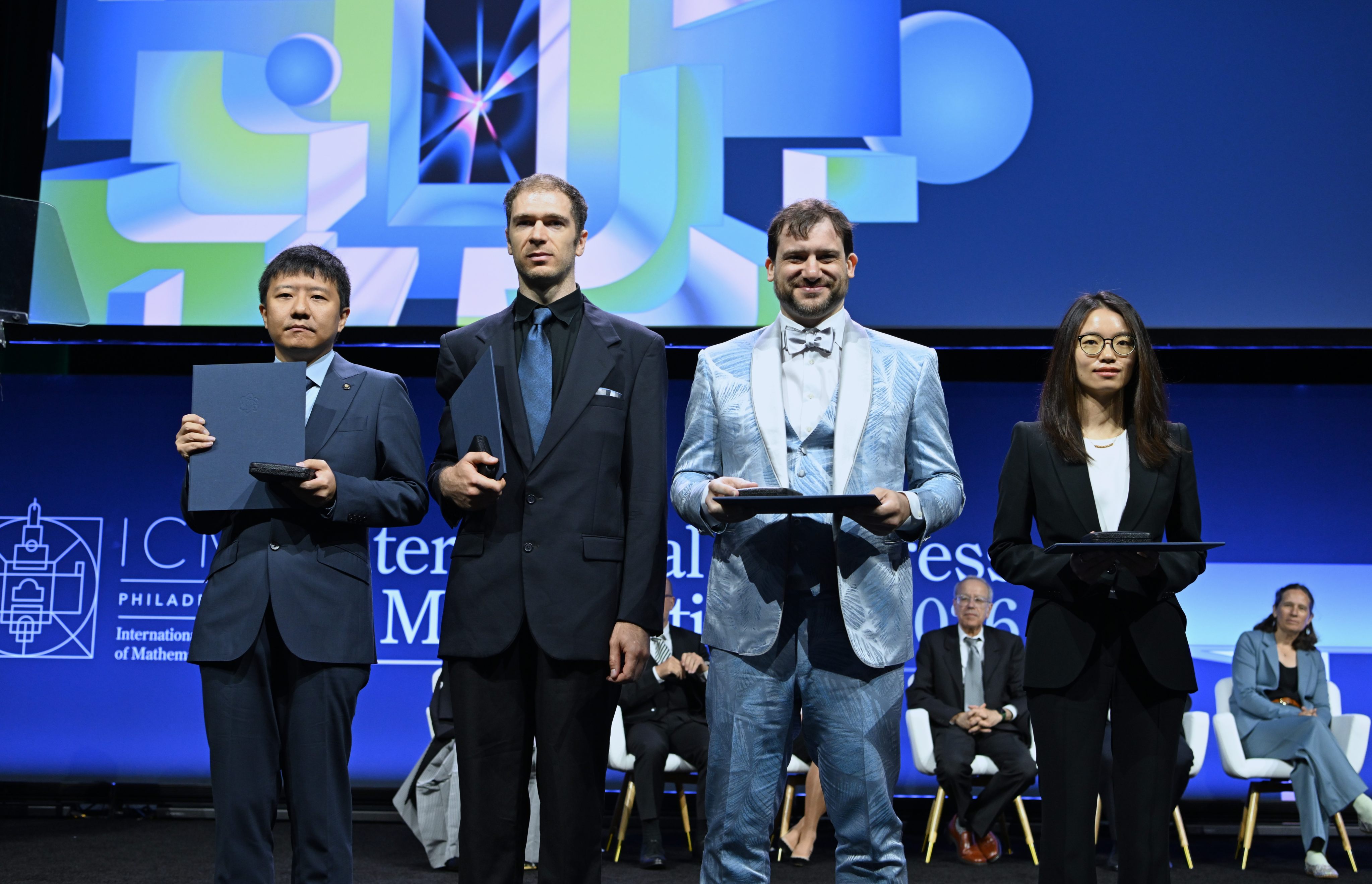 Fields Medalists Deng Yu (first left) and Wang Hong (first right), both Chinese mathematicians, John Pardon (second left), an American mathematician, and Jacob Tsimerman, a Canadian mathematician, pose for a photograph at the opening ceremony of the 2026 International Congress of Mathematicians in Philadelphia, US, on July 23. Photo: Xinhua