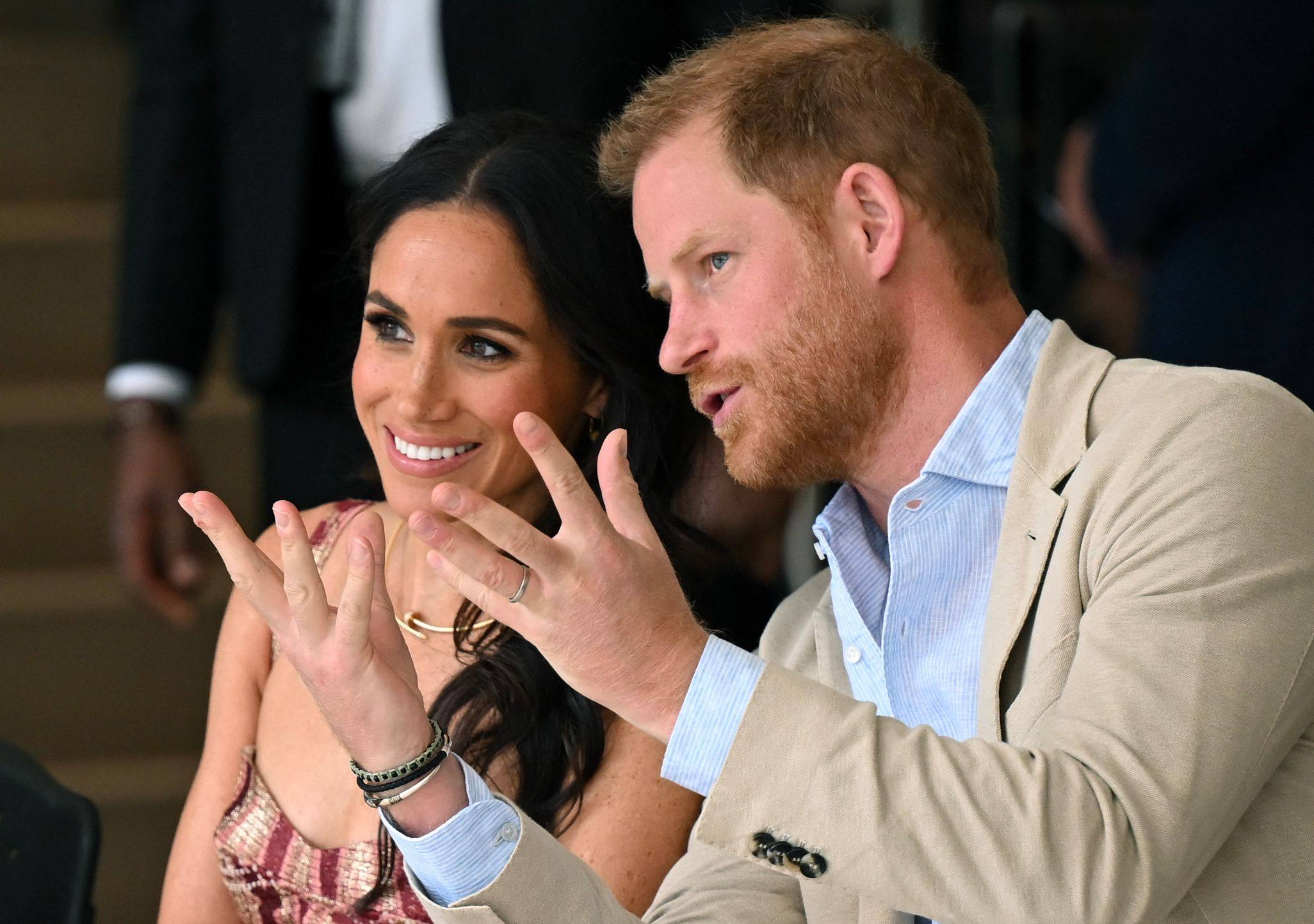 Britain’s Prince Harry speaks with his wife, Meghan Markle, while attending a show during a visit to the National Centre for the Arts in Bogota in August 2024. Photo: AFP