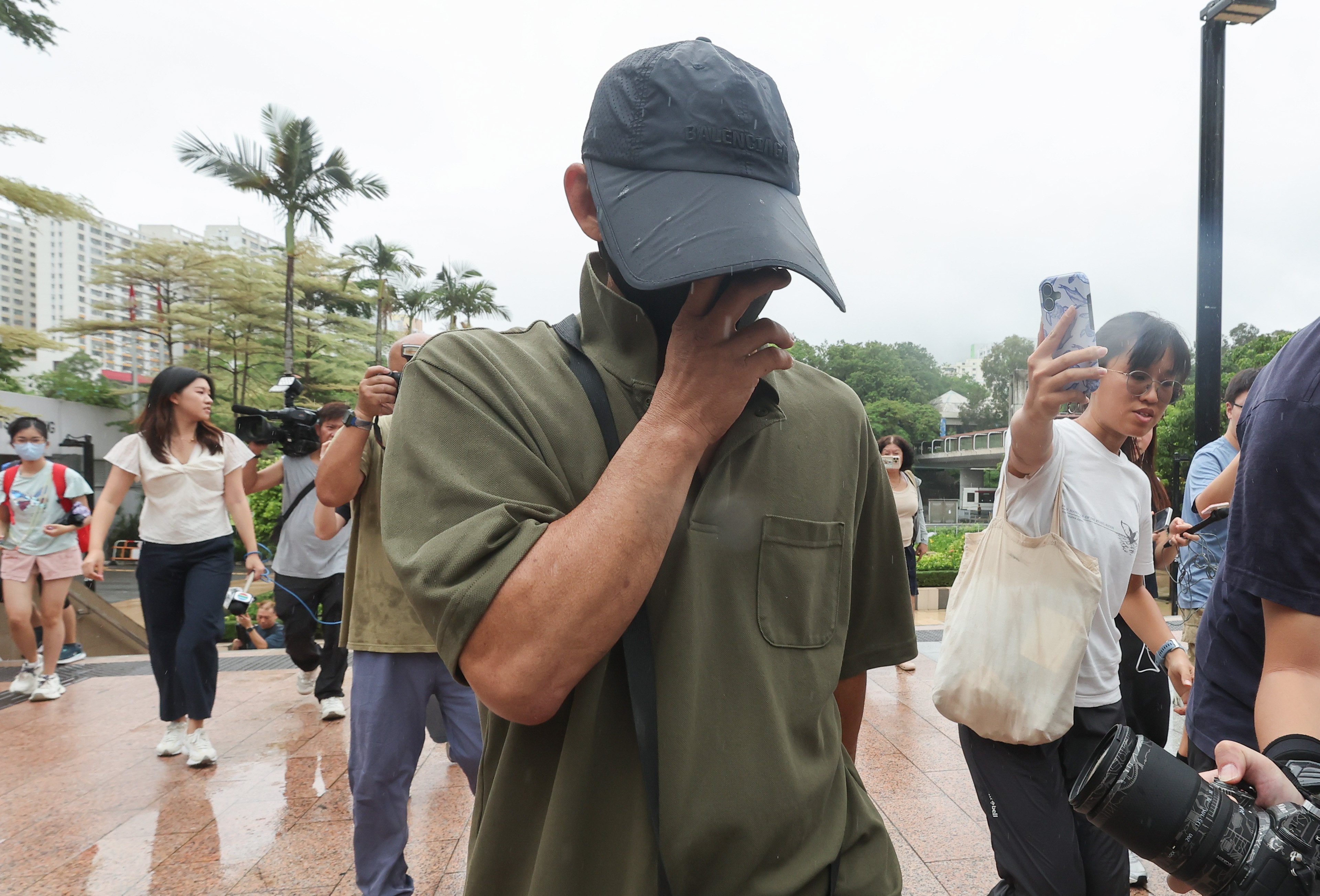 Ng Shui-ting, 52, leaves Tuen Mun Court after being released on bail pending trial over allegations that his 60kg dog killed two pets and injured another. Photo: Edmond So