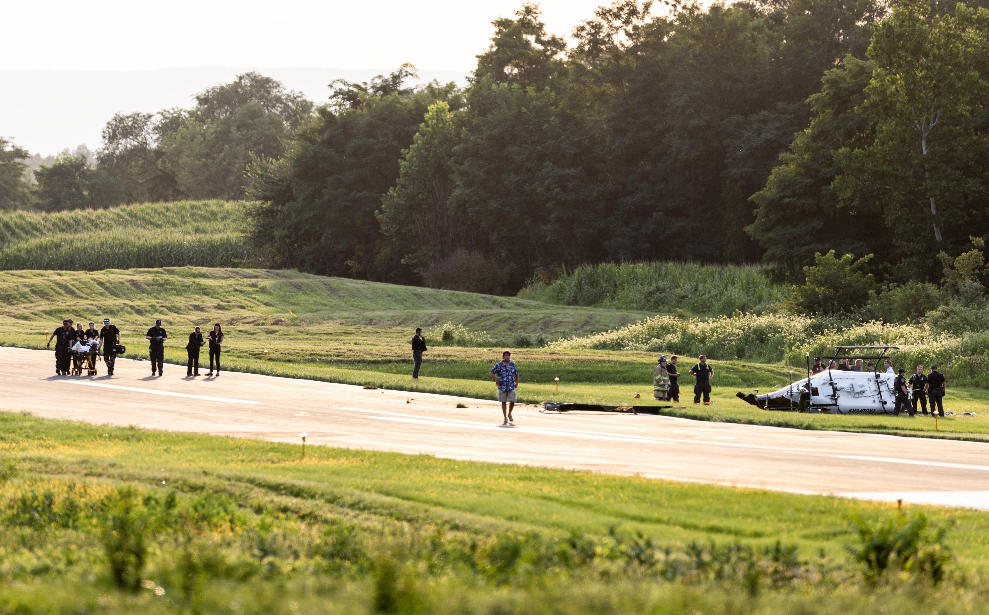 Authorities investigate a crash between a state police helicopter and a small plane at the Carlisle airport in Pennsylvania, the US on Wednesday. Photo: via AP