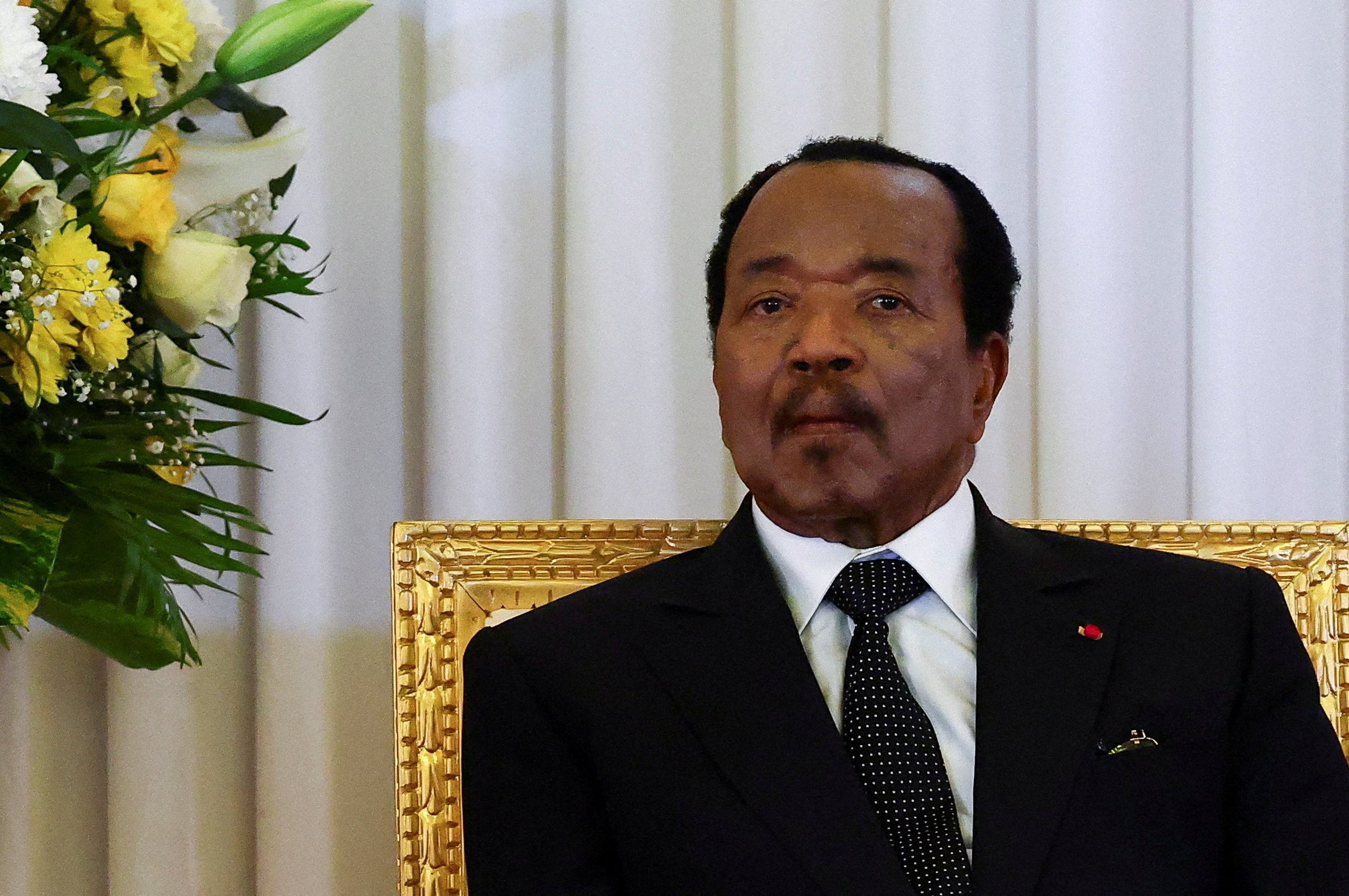 Cameroon President Paul Biya listens as Pope Leo XIV (not pictured) delivers a speech at the Presidential Palace in Yaounde in April. Photo: Reuters