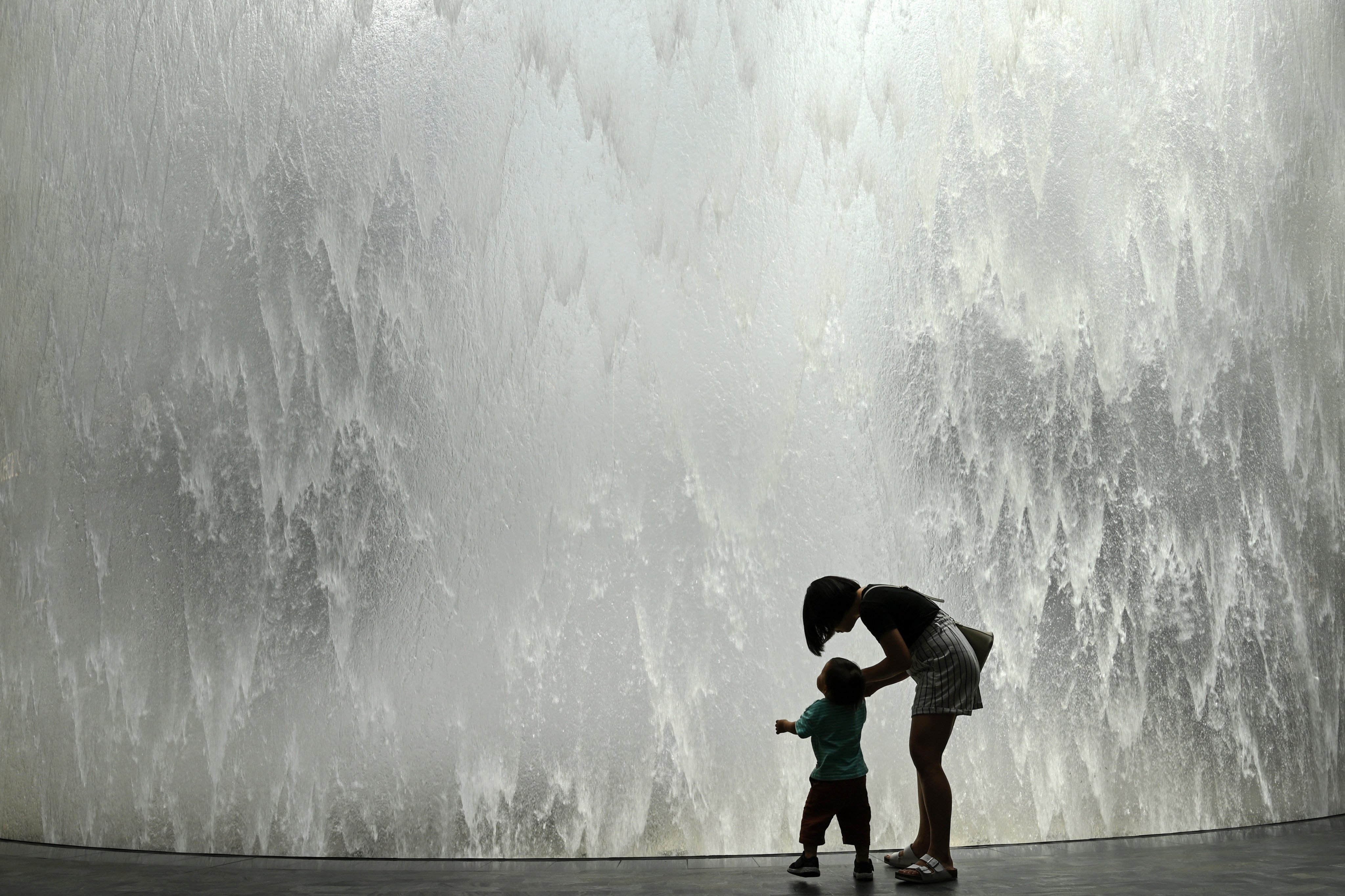 Many Singaporeans are opting out of parenthood due to financial and time constraints. Photo: AFP