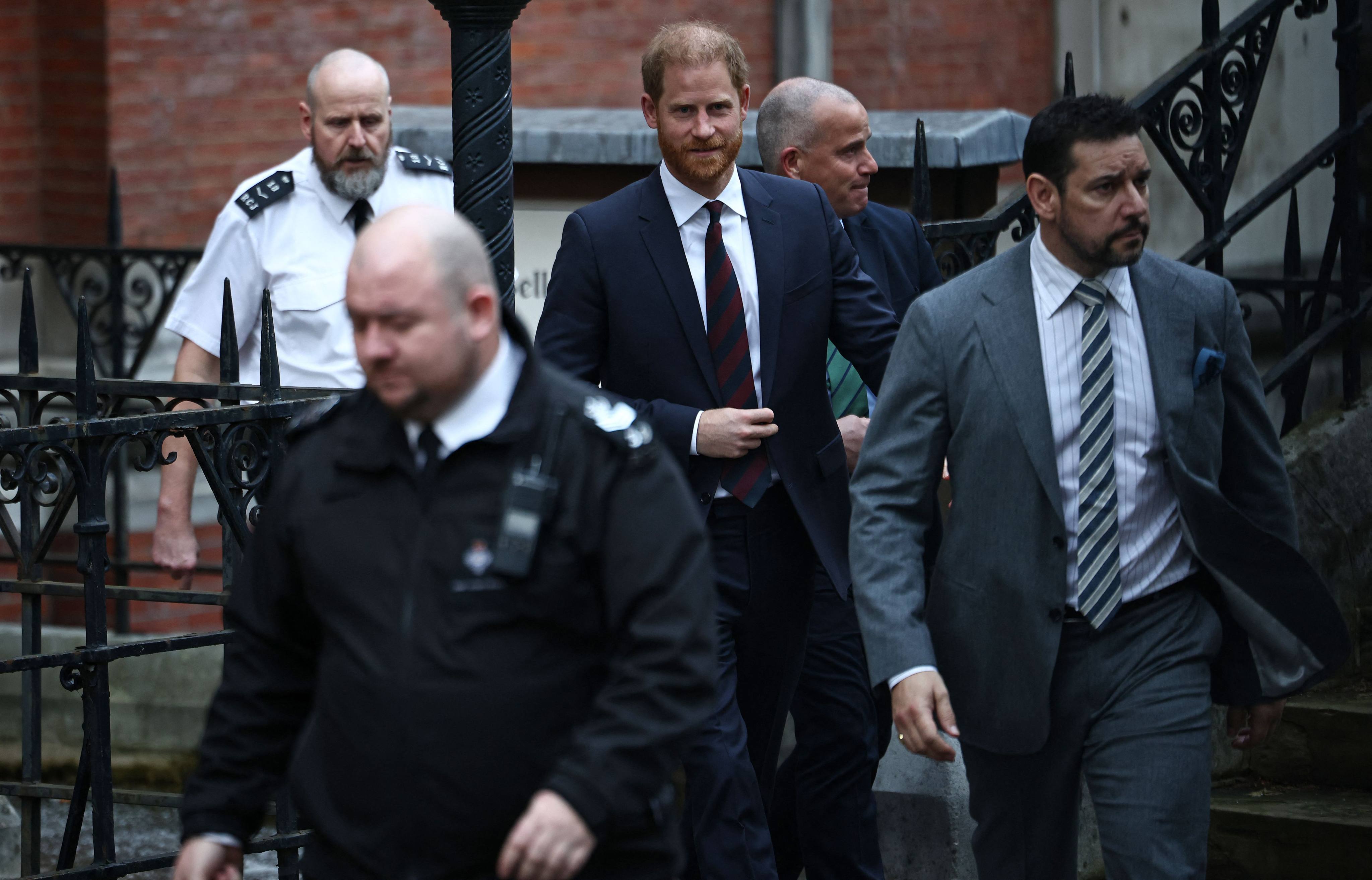 Britain’s Prince Harry leaves the Royal Courts of Justice, Britain’s High Court, in London on January 22, on the fourth day of the trial in his case against a major UK newspaper group. Photo: AFP
