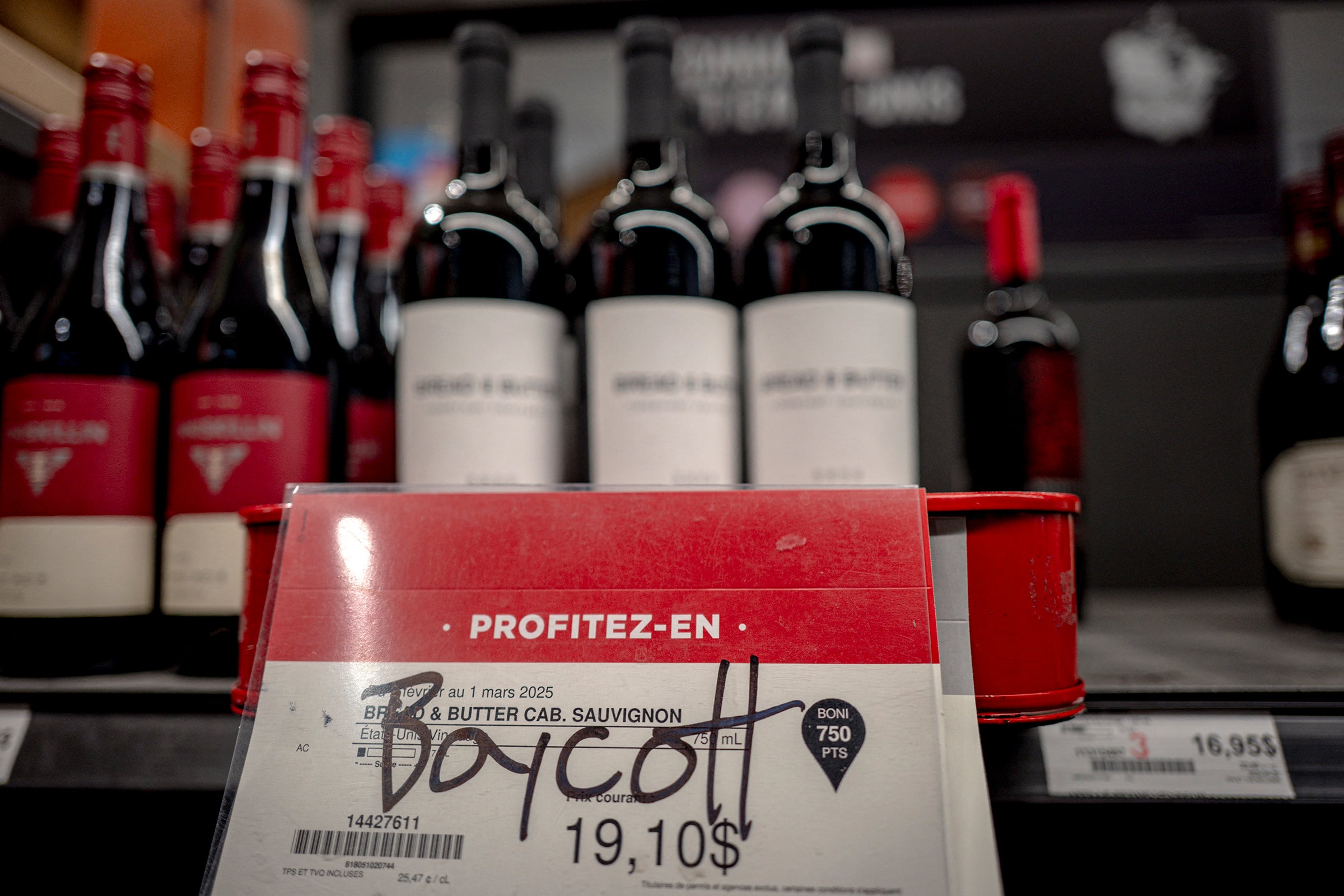 Graffiti calling to boycott American wine is seen at a liquor store in Montreal, Canada. Photo: AFP via Getty Images/TNS