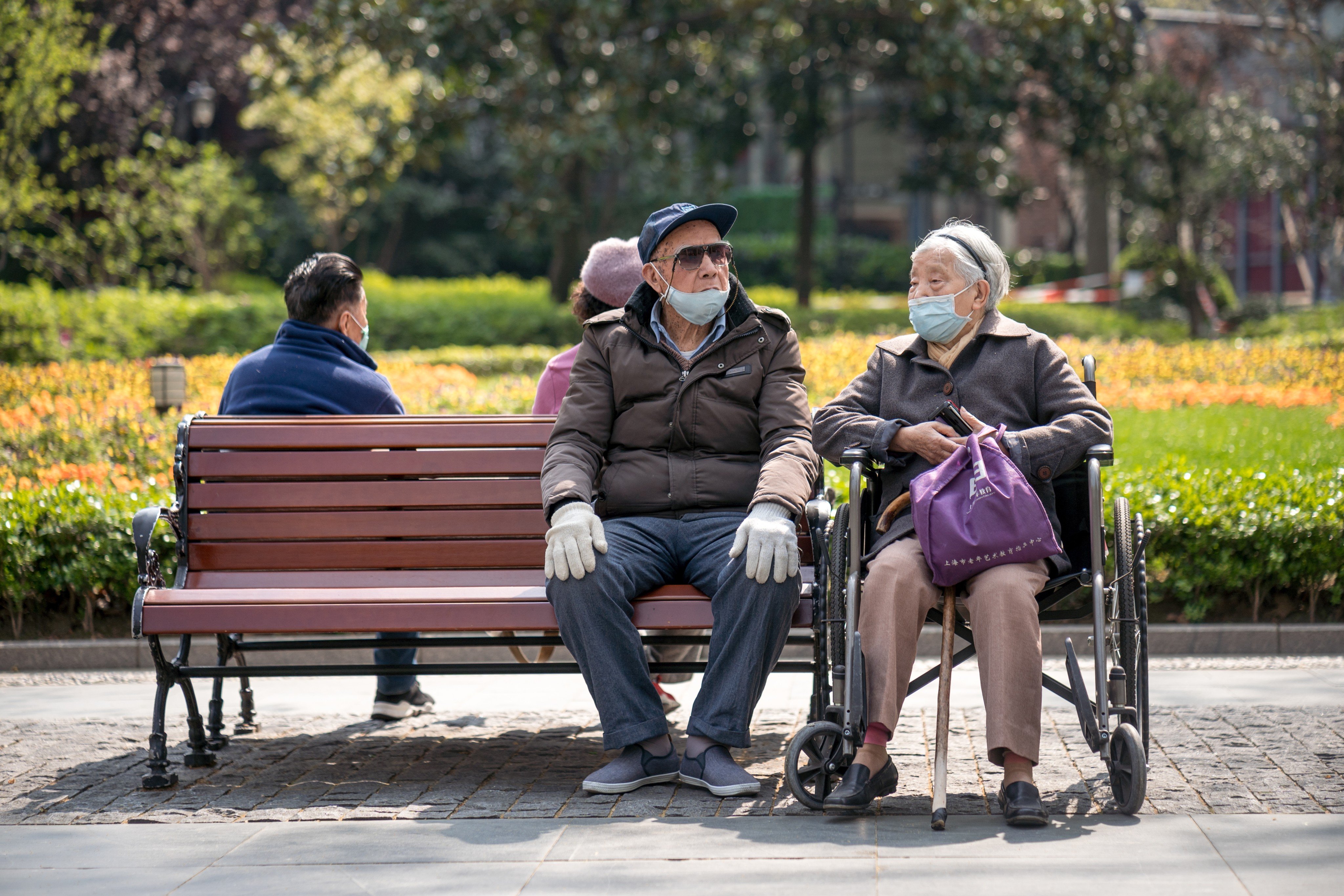 Elderly people enjoy the sunshine in a park in Shanghai. Chinese government departments are increasingly hiring retirees as society ages rapidly. Photo: Shutterstock
