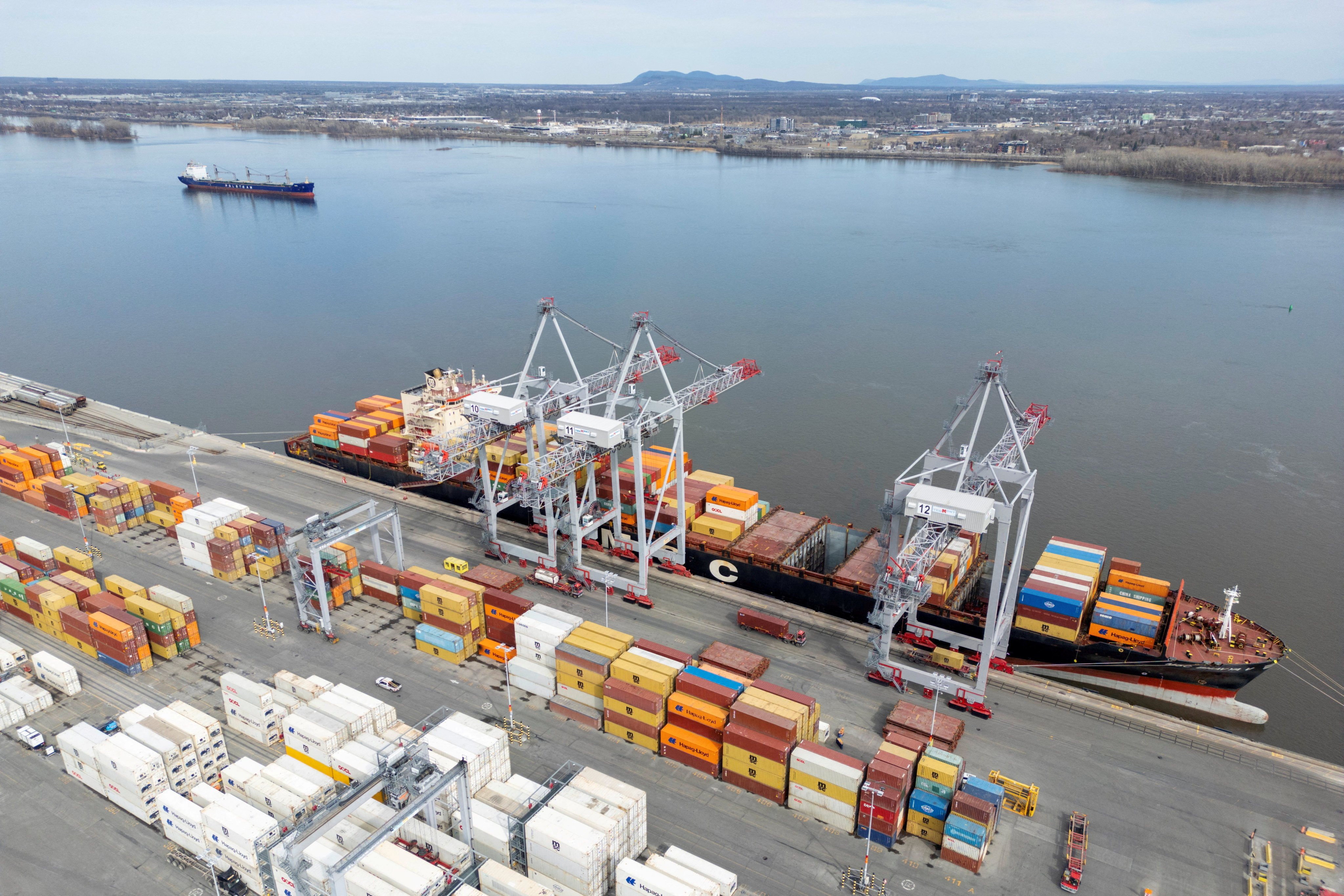 A container ship is loaded while docked at the Port of Montreal in Quebec, Canada. Photo: Reuters