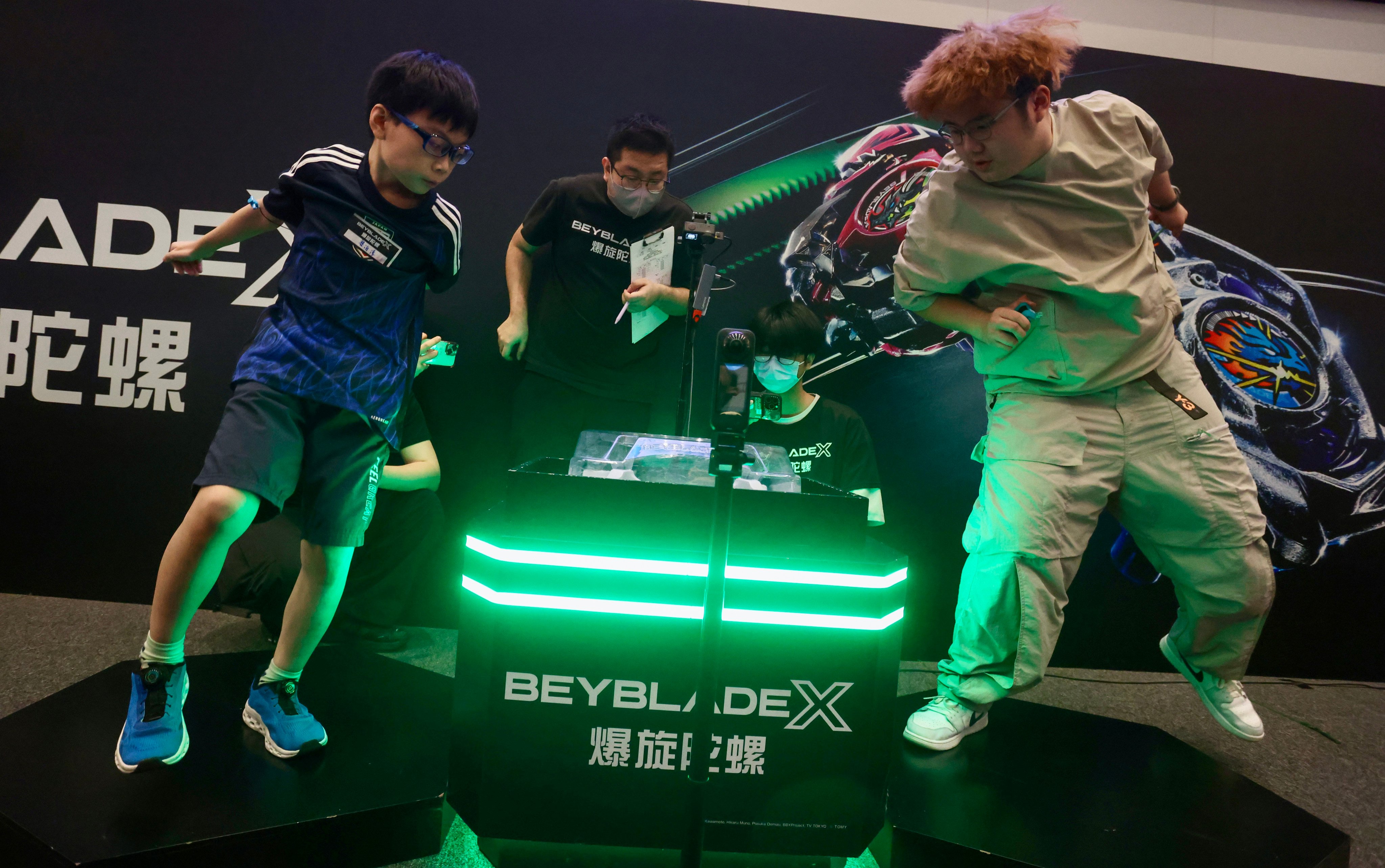 Players at a Beyblade tournament at Tuen Mun Town Plaza earlier this month. The toy popularised by Japanese anime in the early 2000s made a comeback in Hong Kong and elsewhere in Asia early this year, Photo: Jonathan Wong