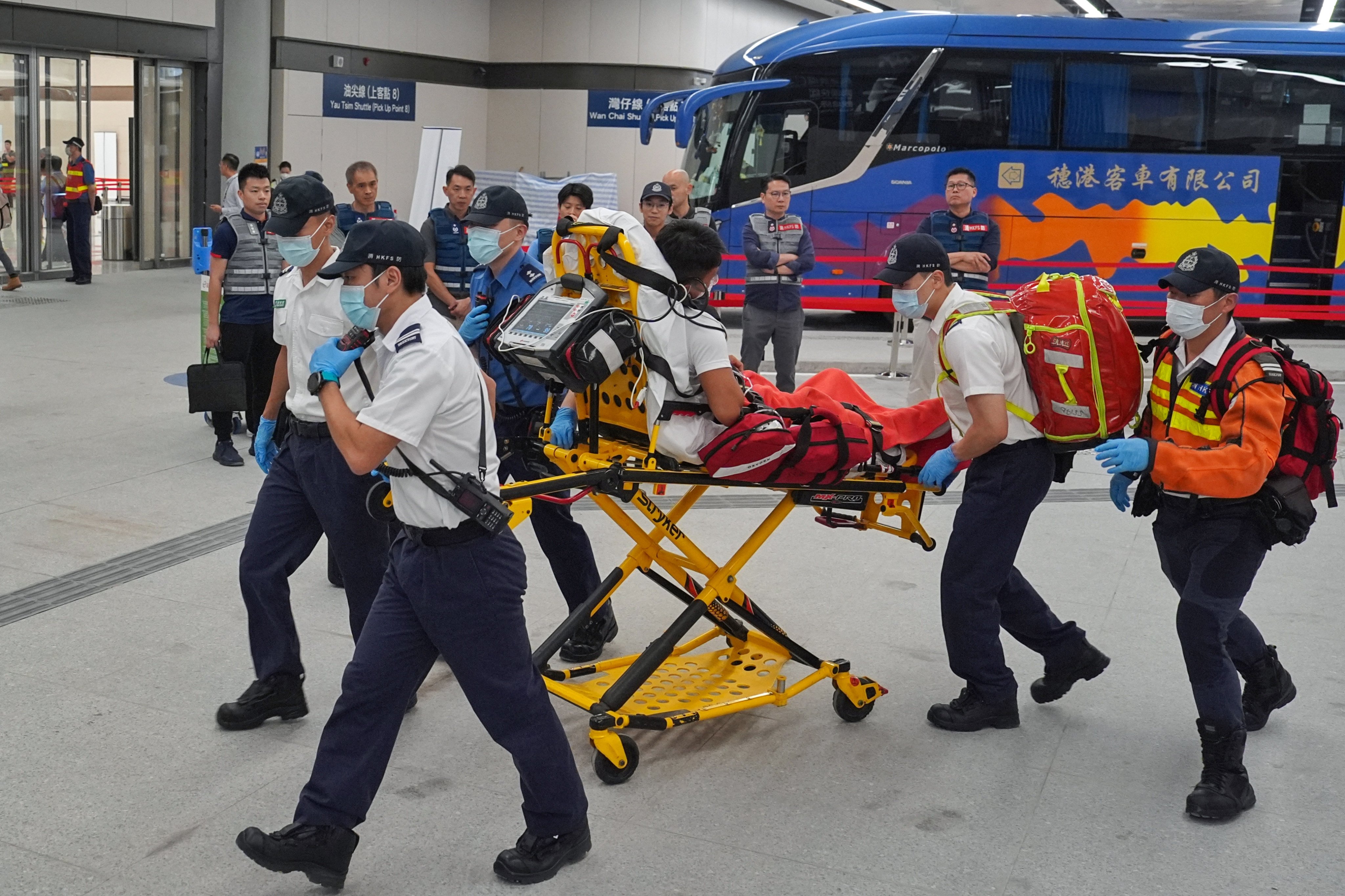 Authorities simulate a scenario where a passenger is found to have a fever and sent for a further check. Photo: Elson Li