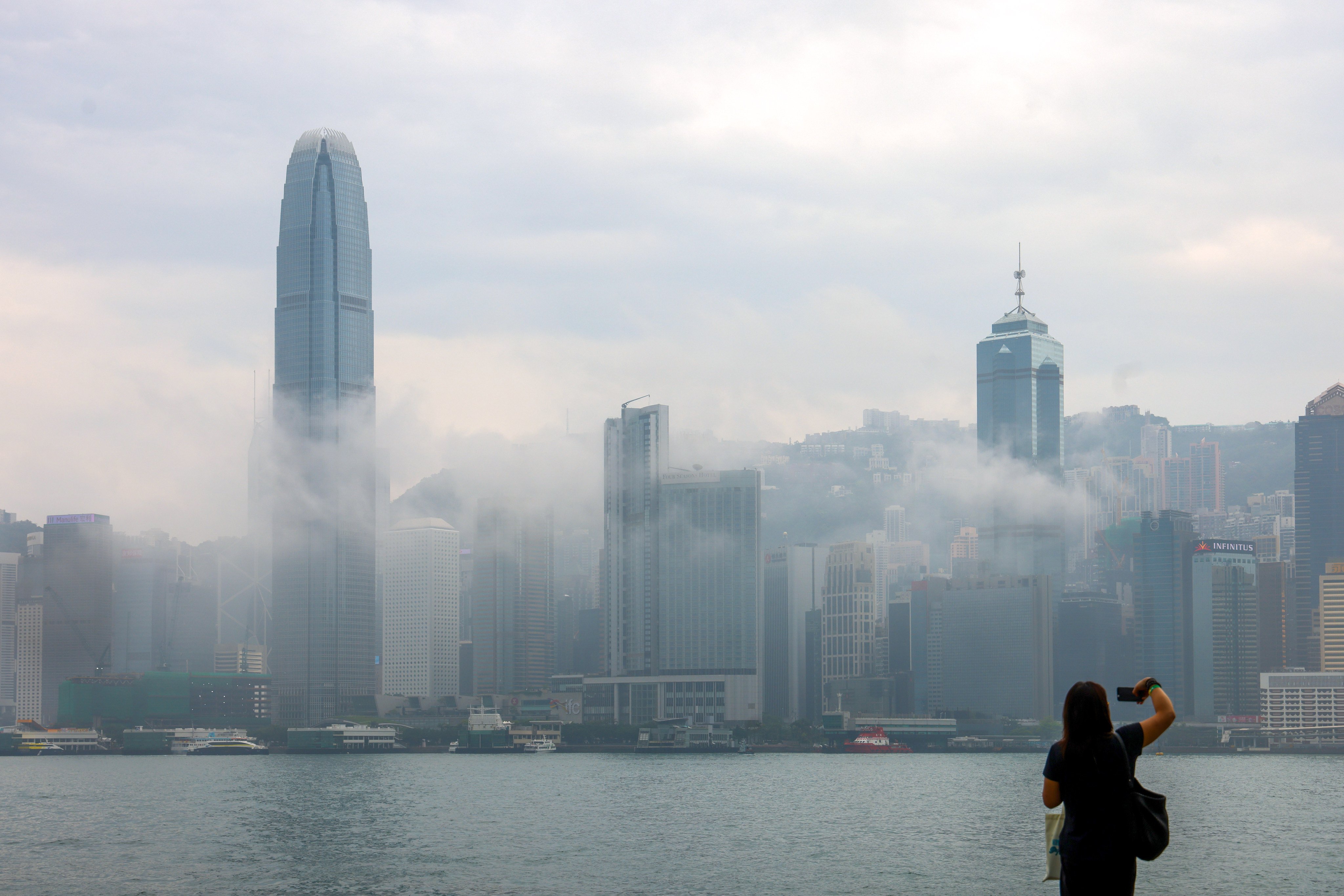 A thick, humid haze settles over Victoria Harbour in April. Hong Kong has set a plan to achieve carbon neutrality before 2050 alongside an overall energy reduction goal. Photo: Dickson Lee