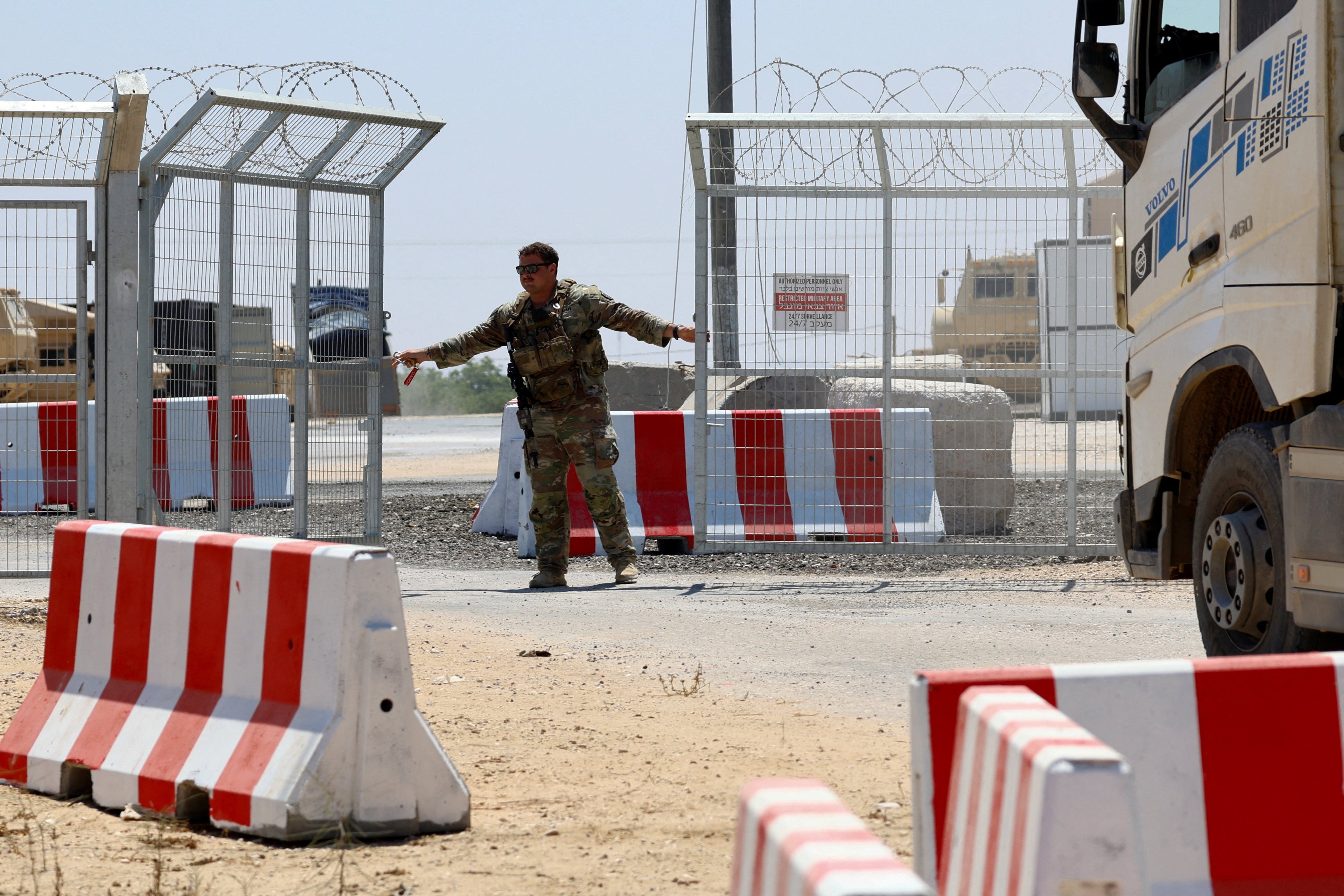A US soldier opens the entrance to LSA Endurance, a facility supporting the International Stabilisation Force in southern Israel, in August. Photo: Reuters