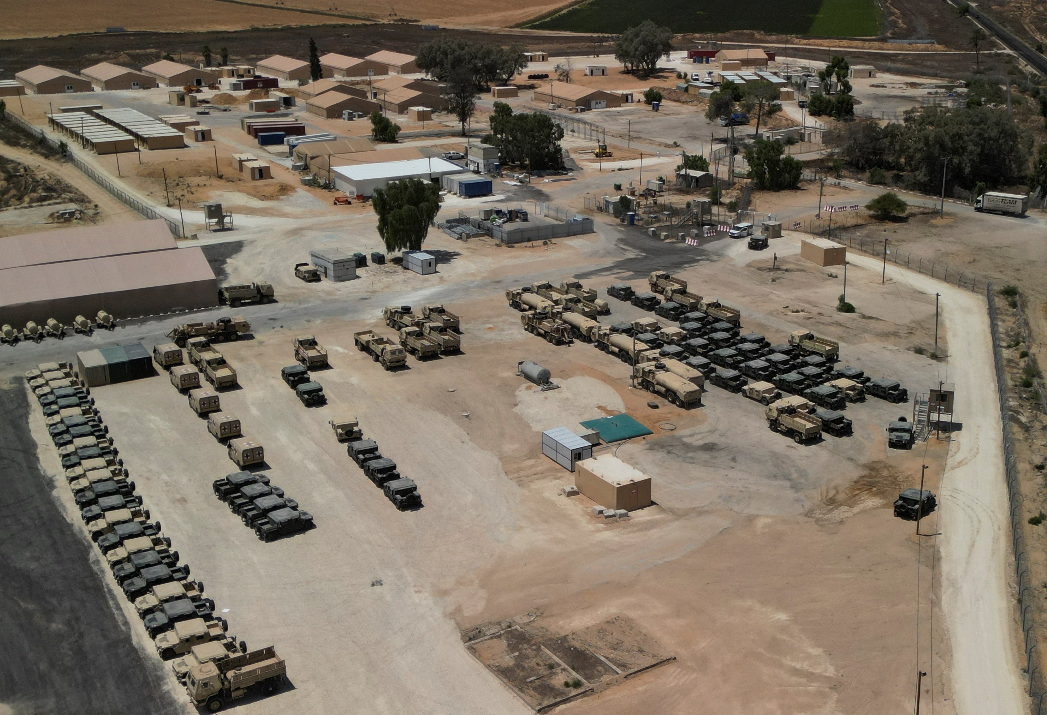 Military vehicles at a logistical support and staging facility to support the International Stabilisation Force under the direction of Trump's "Board of Peace", near the Israel-Gaza border in southern Israel, in August. Photo: Reuters