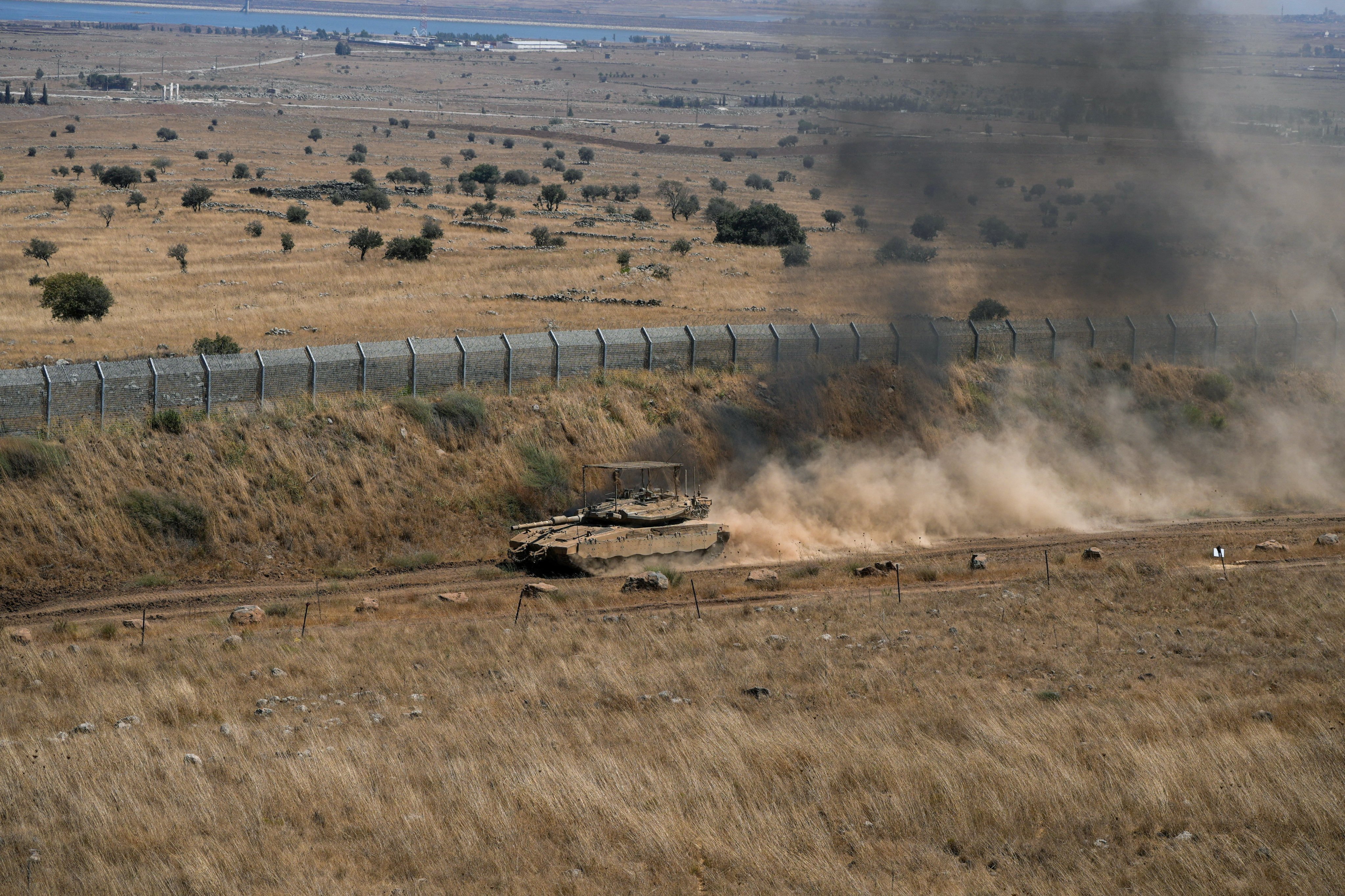 An Israeli tank drives along the ceasefire line between the Israeli-occupied Golan Heights and Syria on Thursday. Photo: Reuters