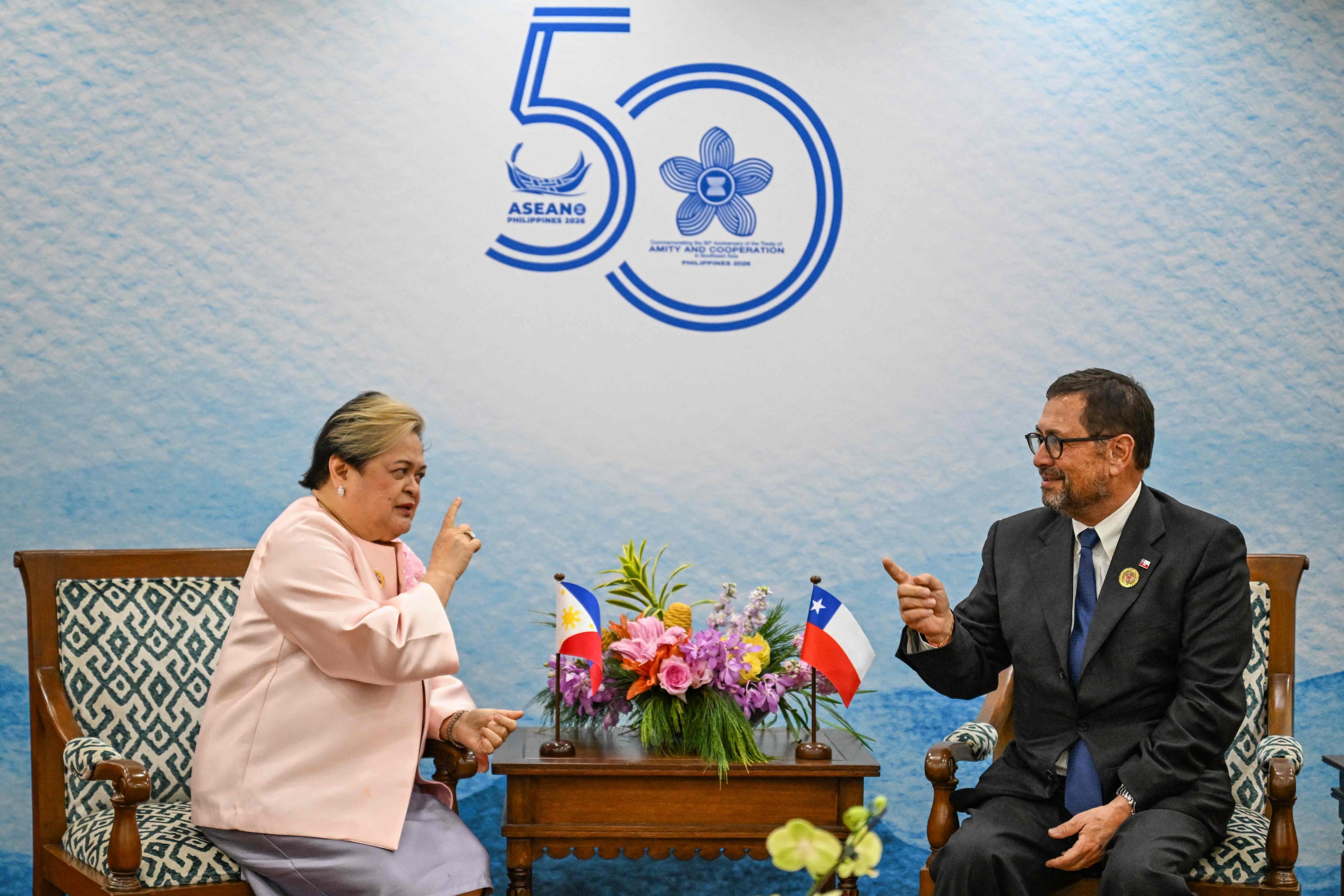 Philippine Foreign Affairs Secretary Maria Theresa Lazaro (left) and Chile’s Foreign Affairs Minister Francisco Perez Mackenna talk during a meeting in Metro Manila last month. Photo: AFP