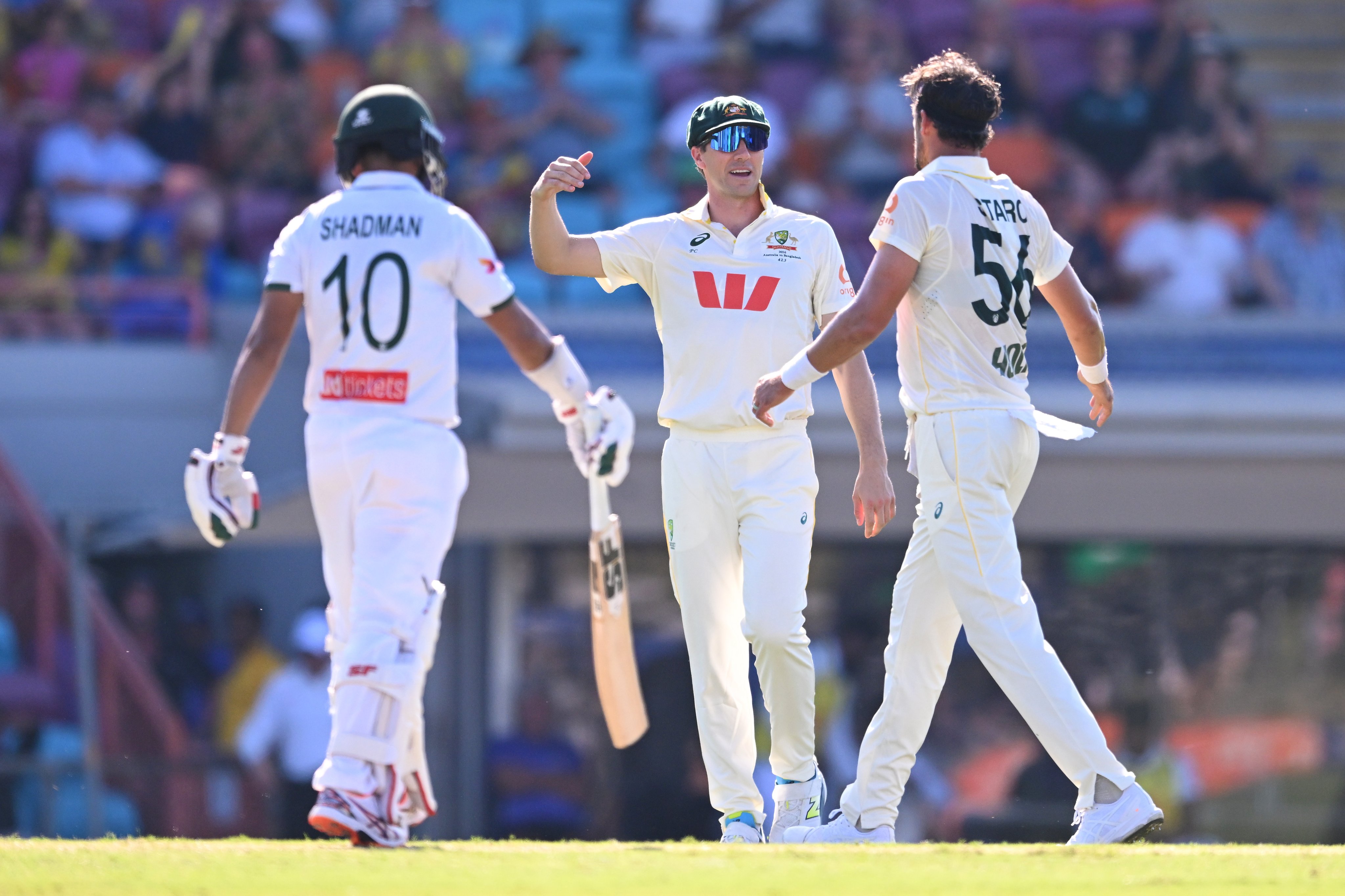 Australian bowler Pat Cummins (centre) celebrates after Mitchell Starc (right) takes the wicket of Shadman Islam of Bangladesh during the First Men’s cricket test match between Australia and Bangladesh at TIO Stadium in Darwin,  Australia, 13 August 2026.  EPA/JAMES ROSS AUSTRALIA AND NEW ZEALAND OUT