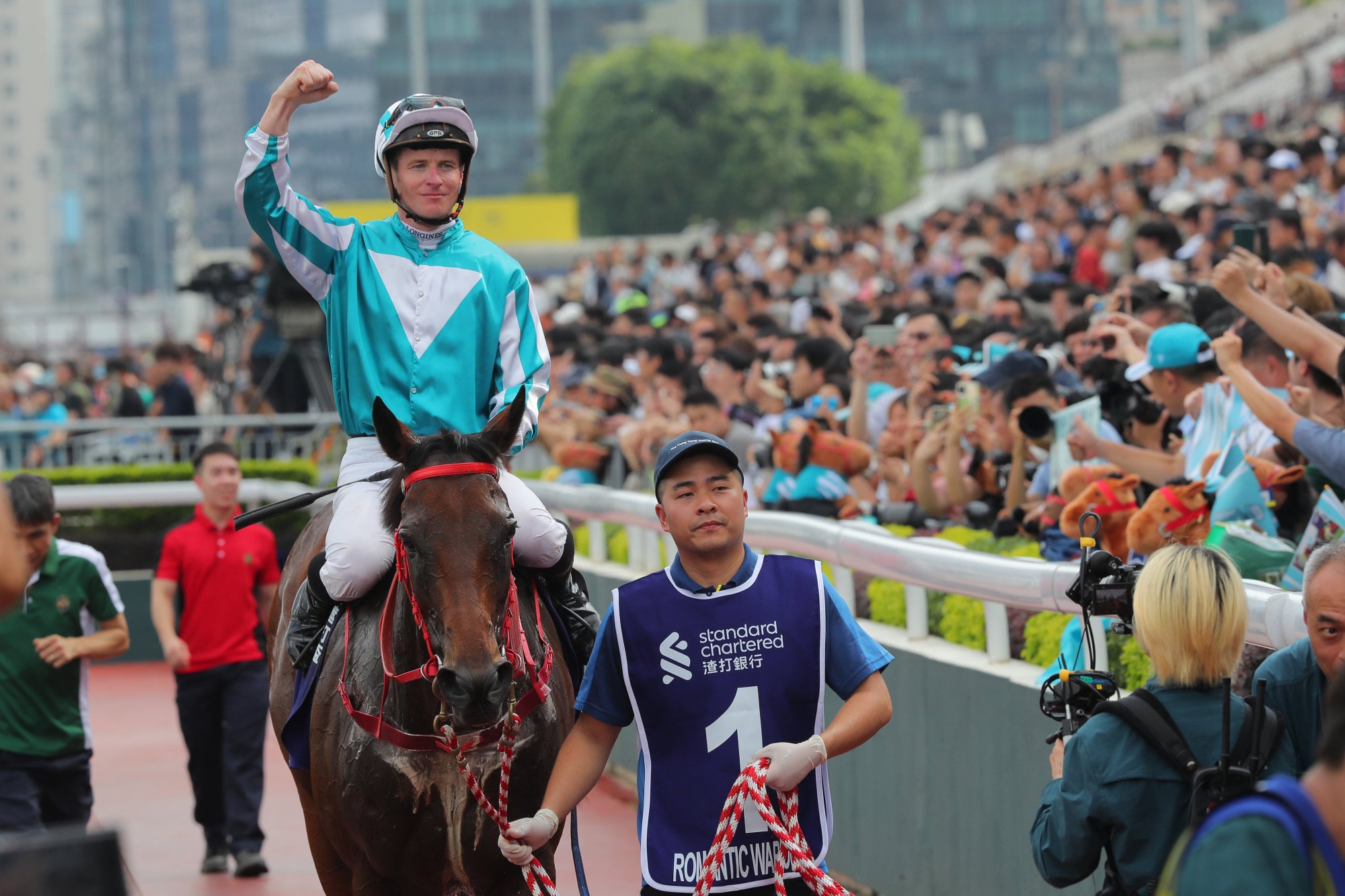 James McDonald pumps his fist in celebration after Romantic Warrior seals Triple Crown glory. James McDonald pumps his fist in celebration after Romantic Warrior seals Triple Crown glory.