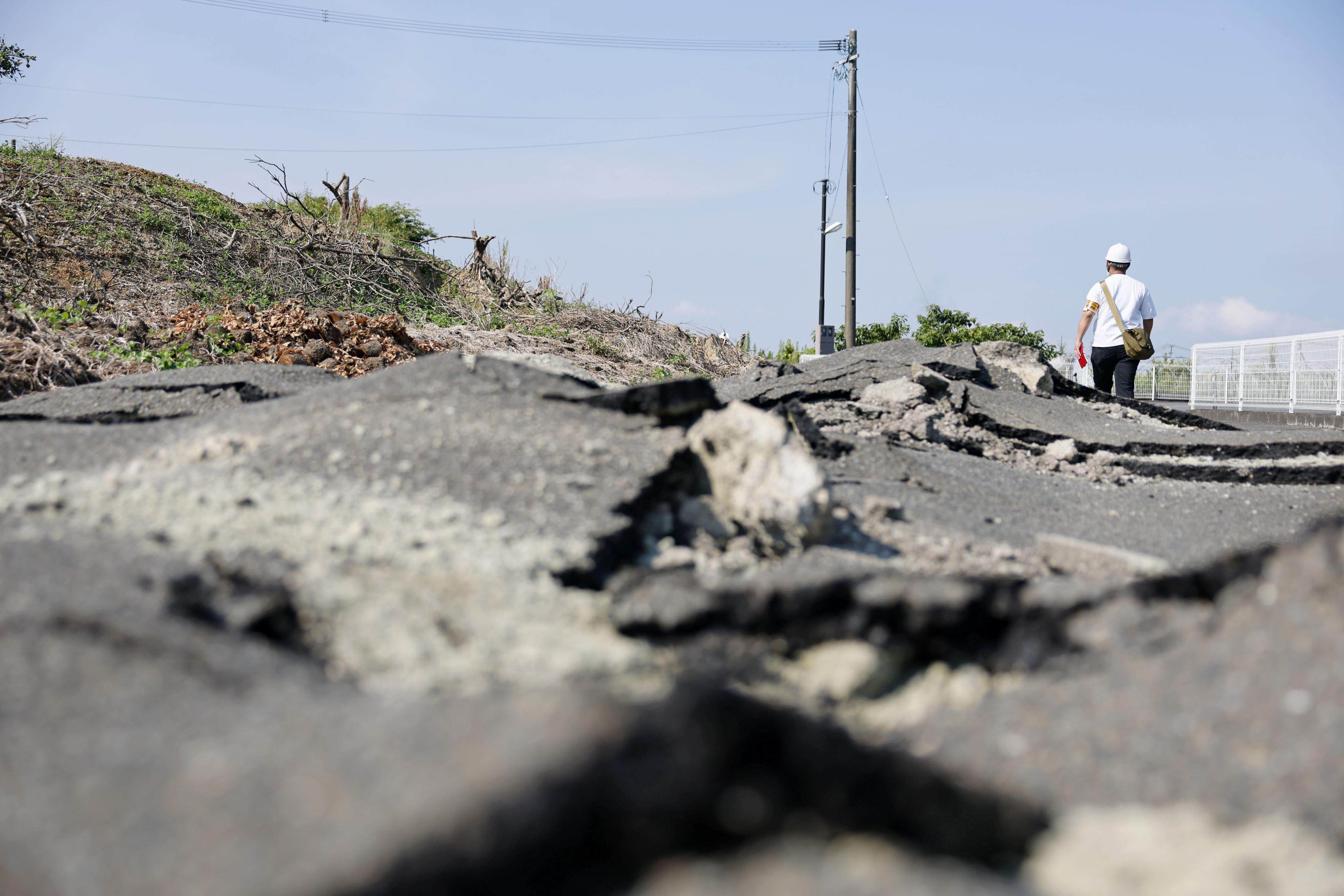 Ground fissures are seen on a road in Hikawa, Kumamoto prefecture, on August 2, in the wake of the July 28 earthquake. Photo: Kyodo
