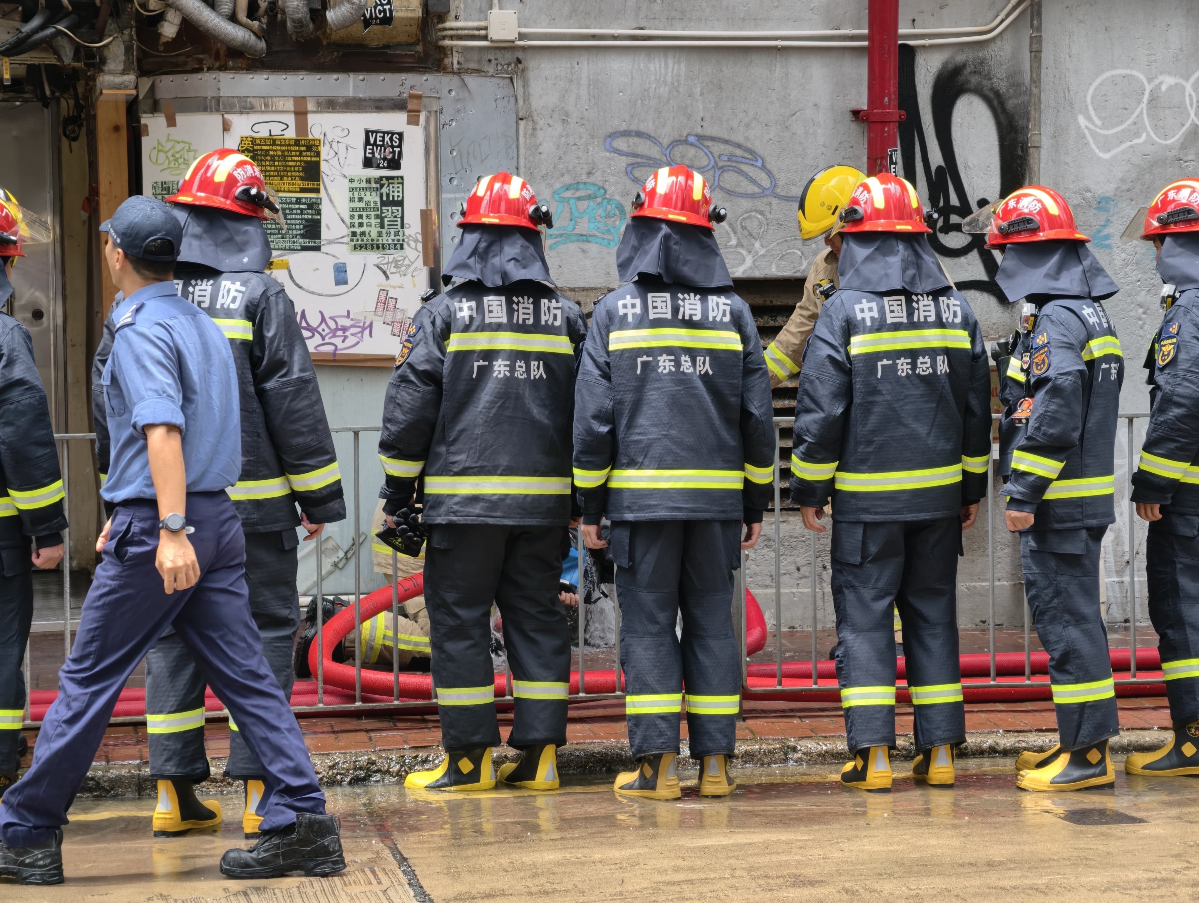 Firefighters help extinguish the fire that broke out in a flat in Hong Kong on Tuesday. Photo: Handout
