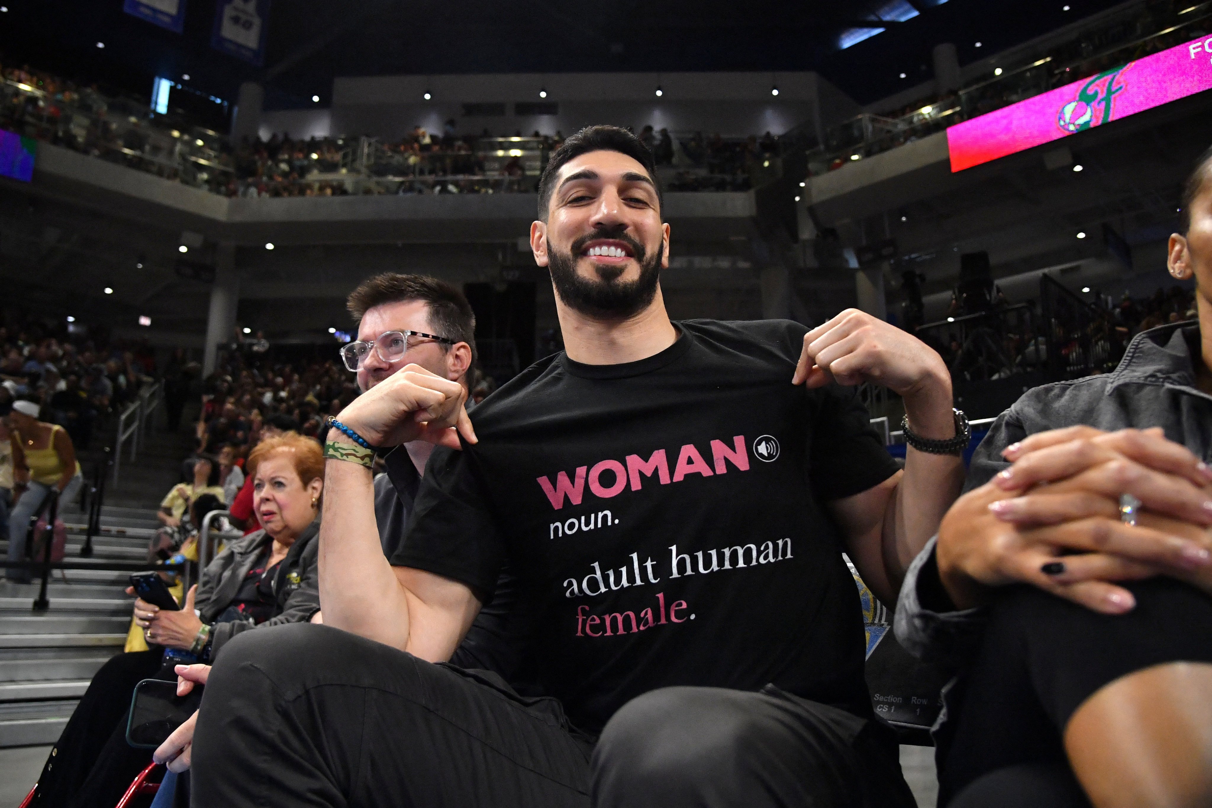 Former NBA player Enes Kanter Freedom wore a black T-shirt reading “Woman: noun, adult human female” at a WNBA game between the Chicago Sky and Indiana Fever on August 23. Photo: Imagn Images