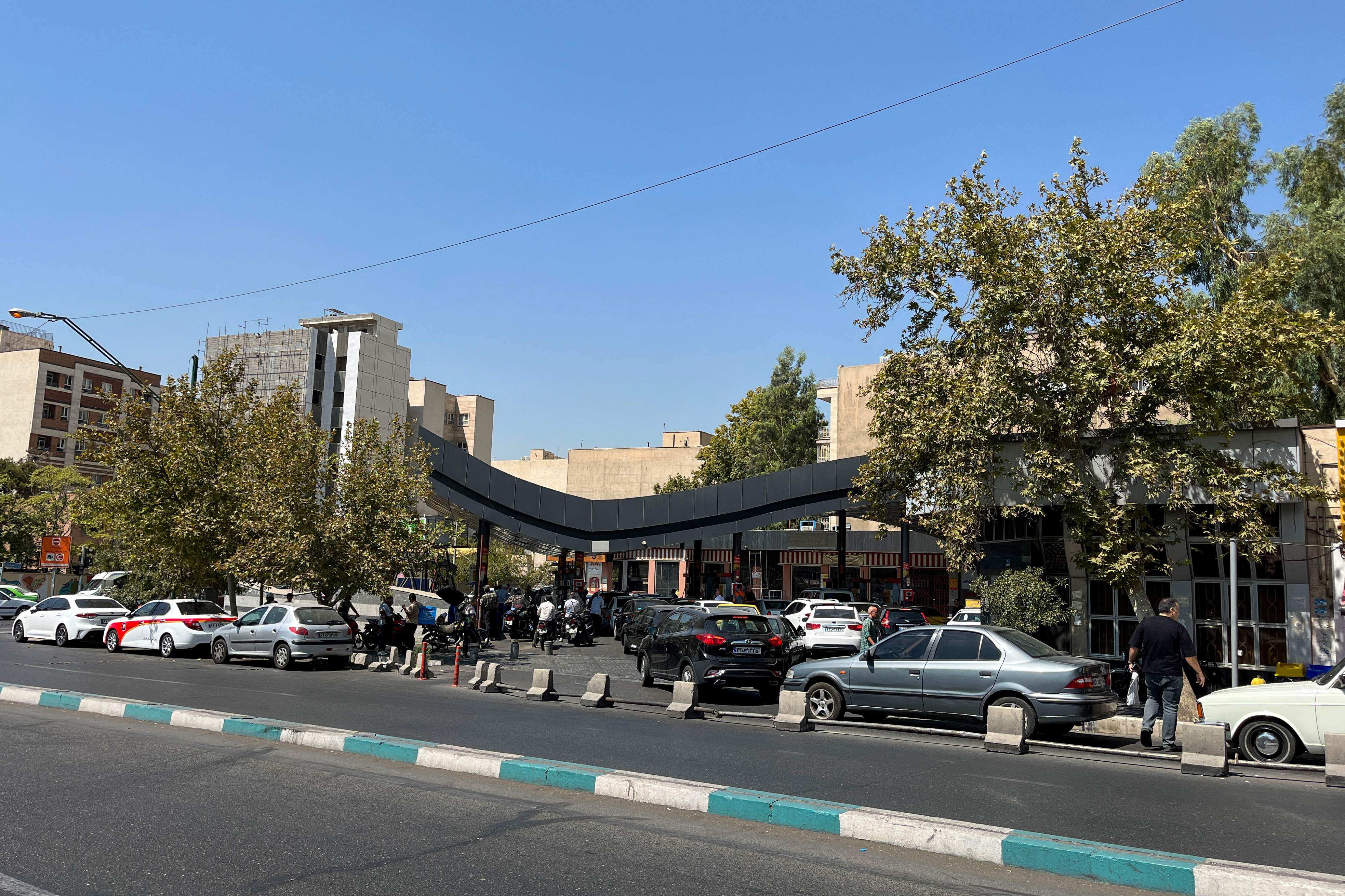Drivers queue at a petrol station to refuel in Tehran, Iran, on Tuesday. Photo: AFP