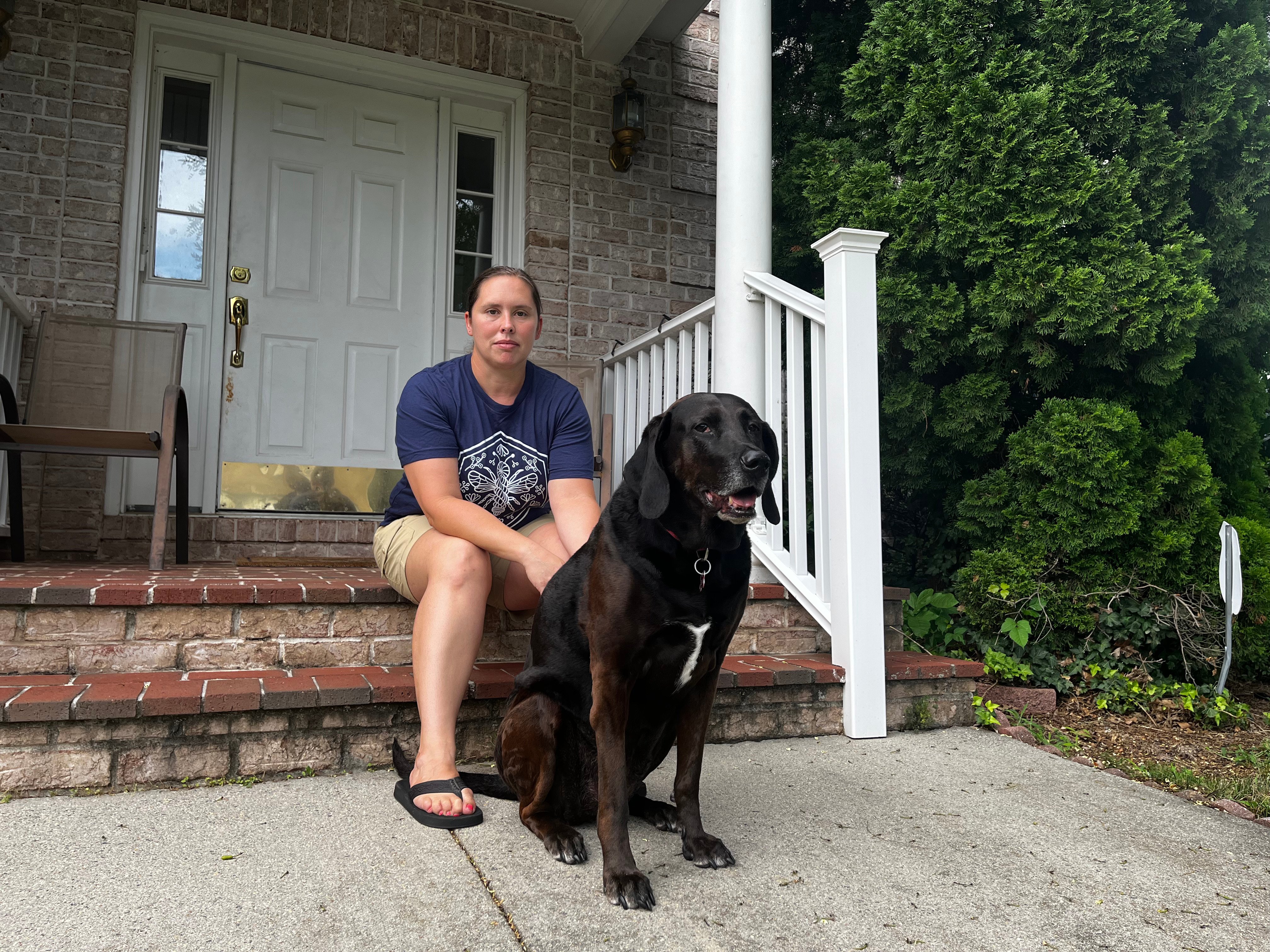 Lindsay Shaw sits outside her home in Sterling, northern Virginia, located across from a huge data centre. Photo: Handout