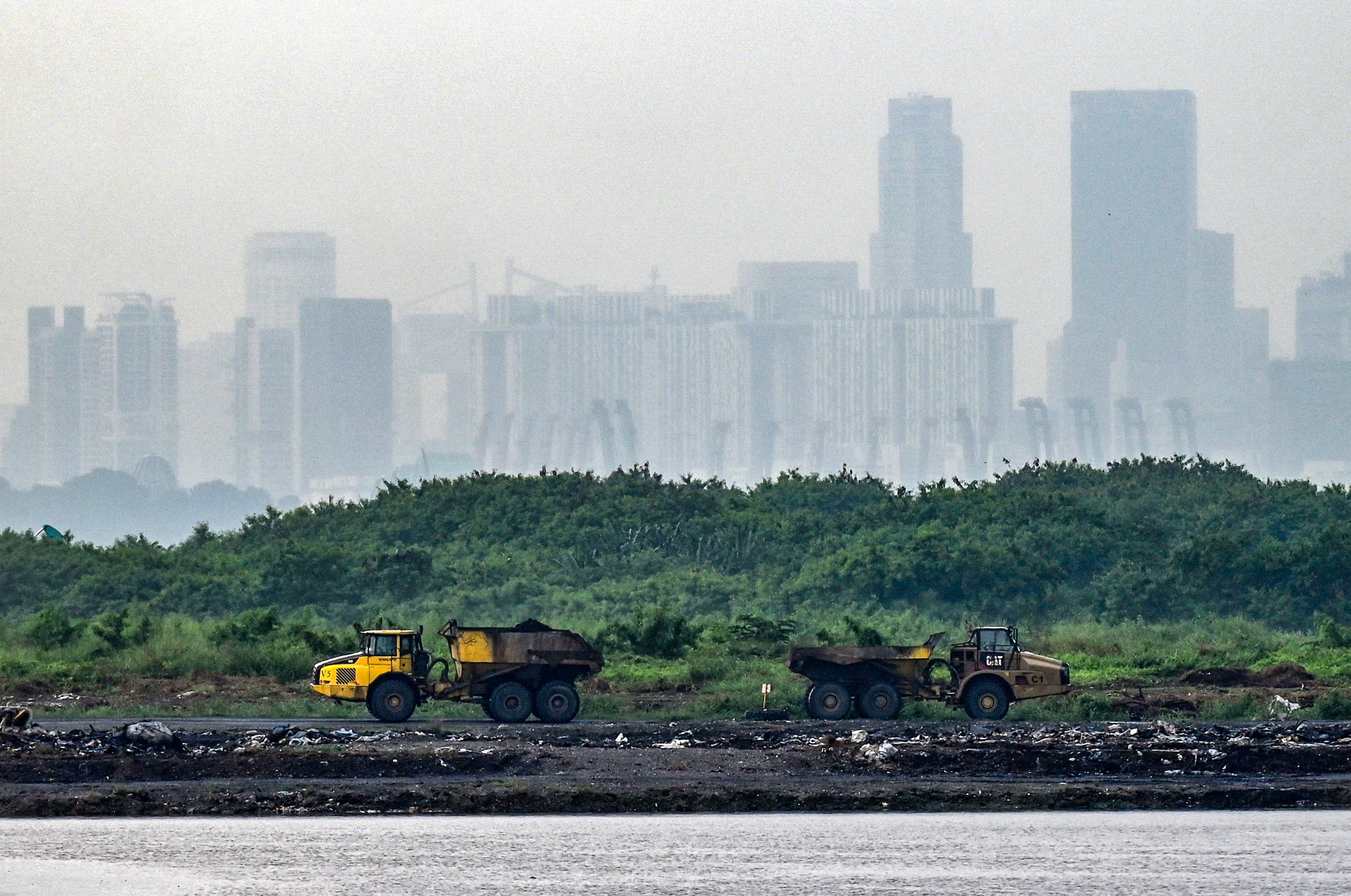 Trucks transporting ash from incinerated garbage on Pulau Semakau, which serves as Singapore’s offshore landfill. Photo: AFP