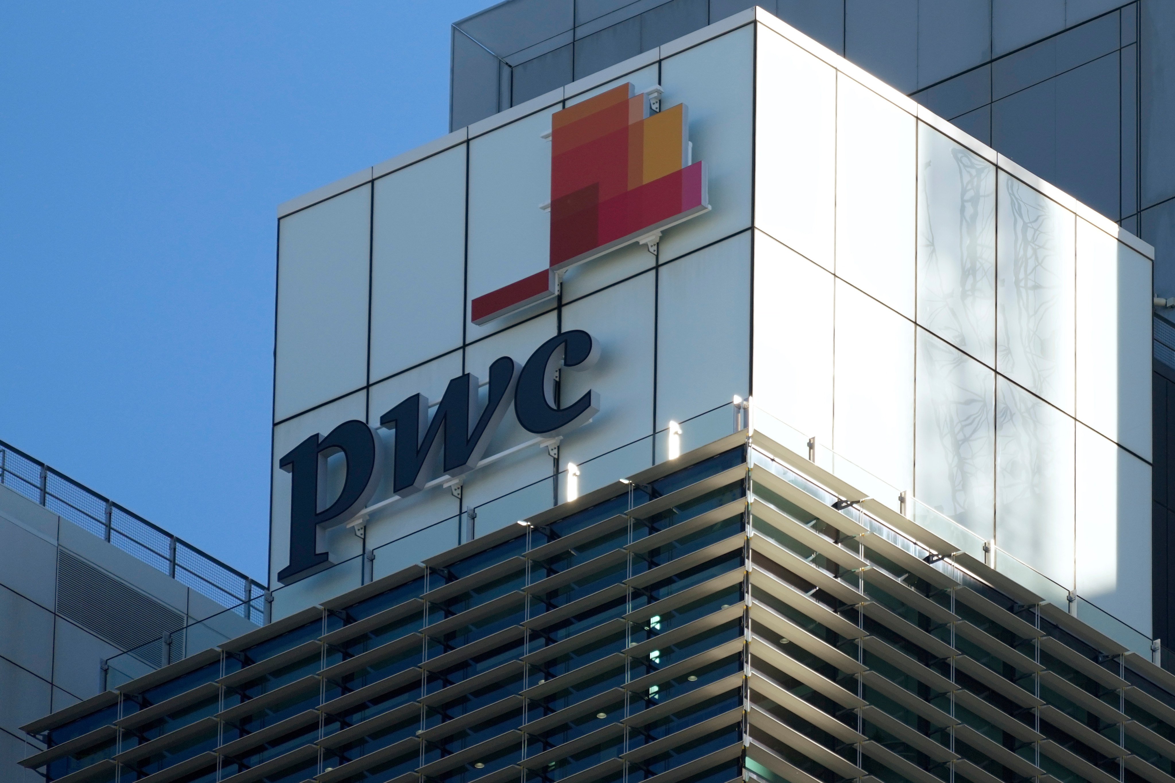 Signage appears on the Australian head office building of PWC in Australia. Photo: AP