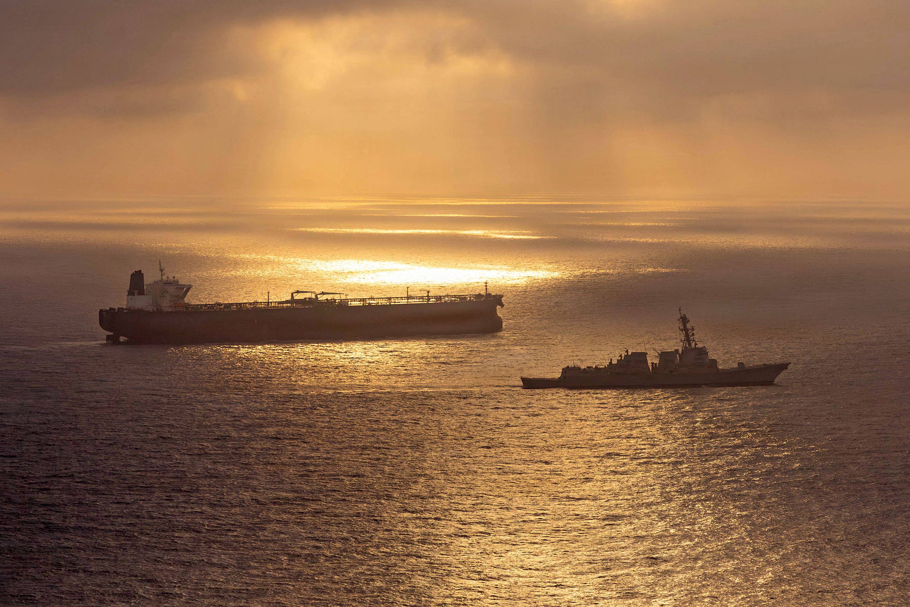 A US guided-missile destroyer blocks an Iran-flagged crude oil tanker attempting to sail towards an Iranian port on April 24. Photo: AFP