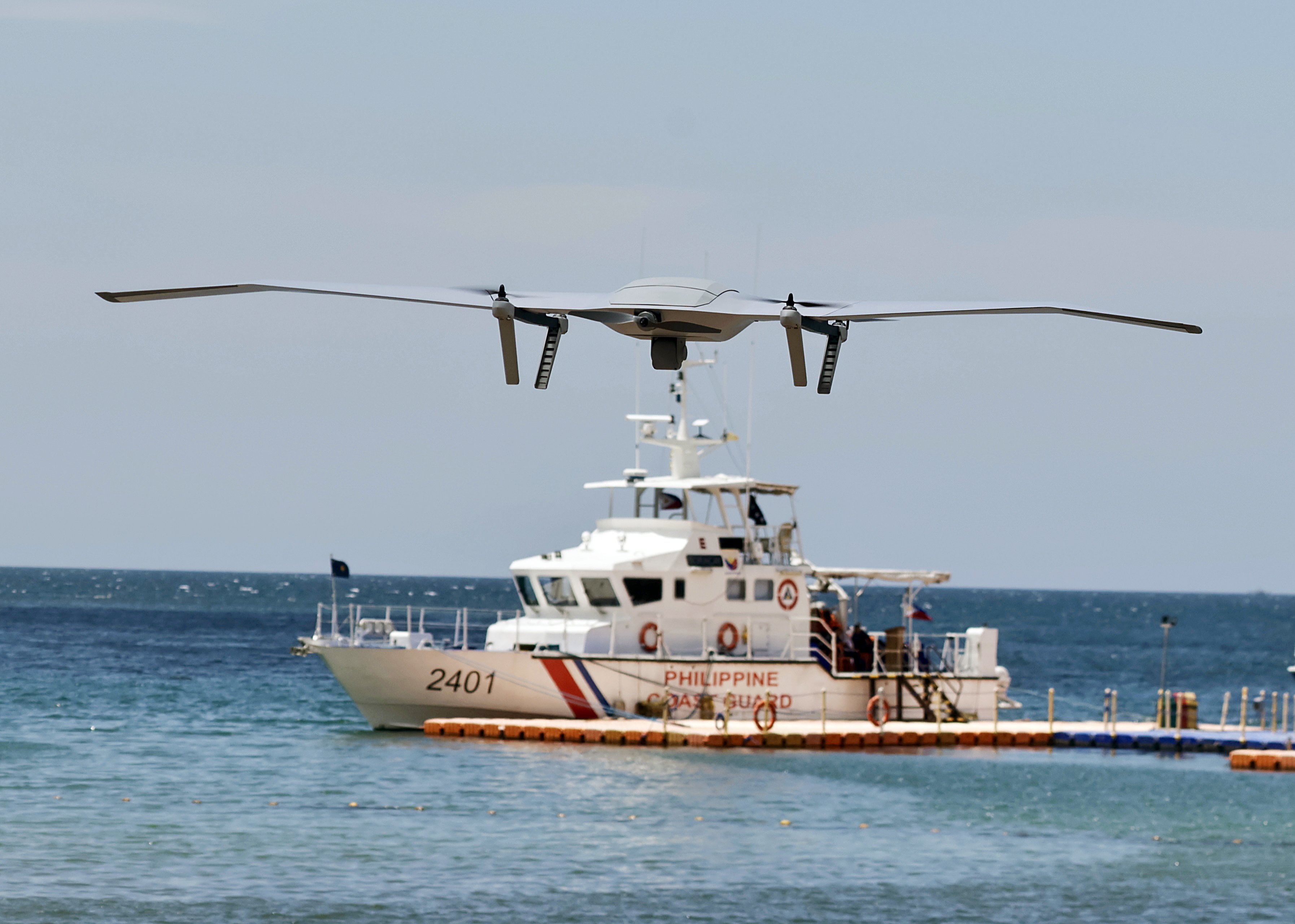 A drone hovers above a Philippine Coast Guard patrol vessel in Bataan province in April 2025. Photo: EPA-EFE