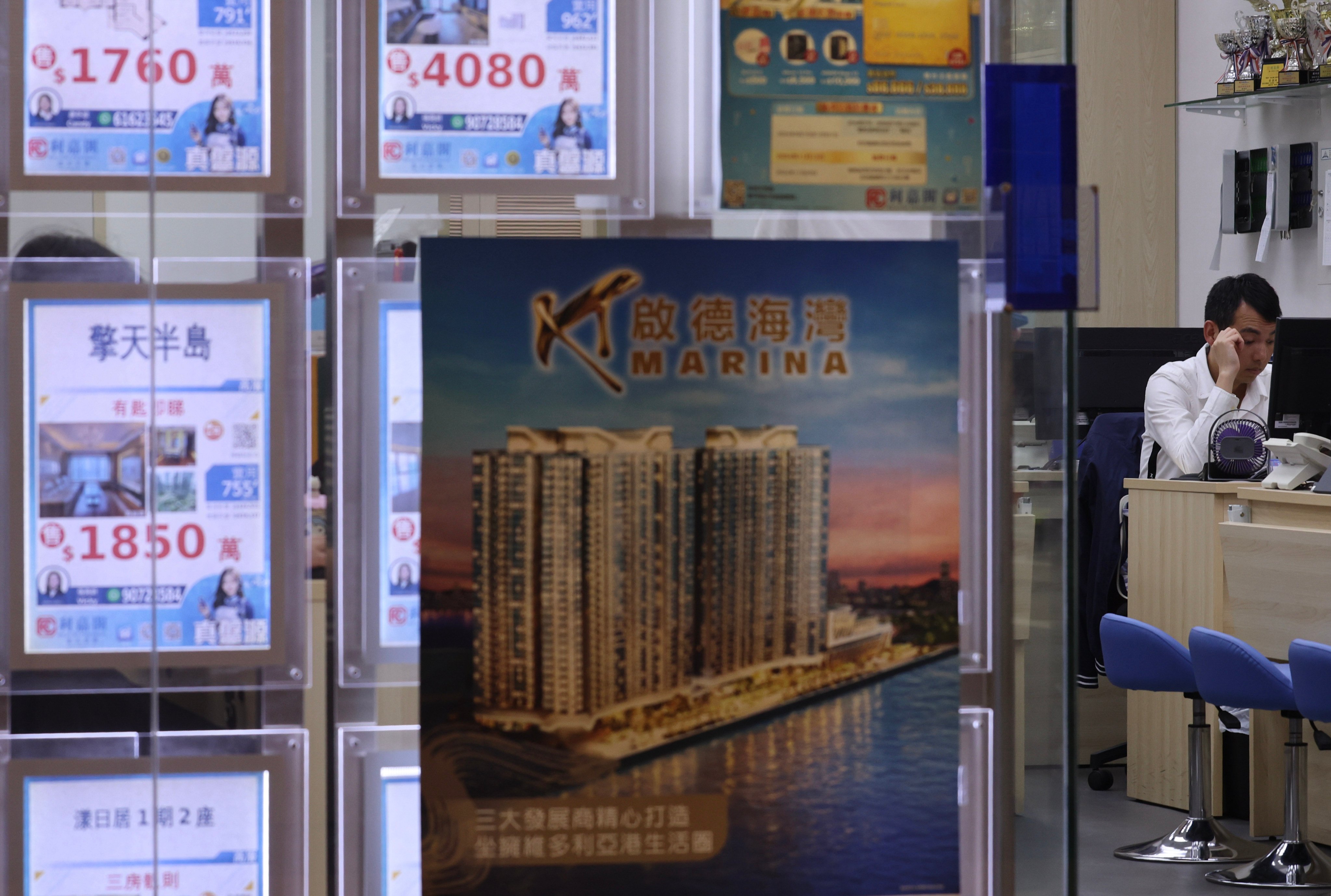 Residential property advertisements at a real estate agency in Jordan. Photo: Jelly Tse