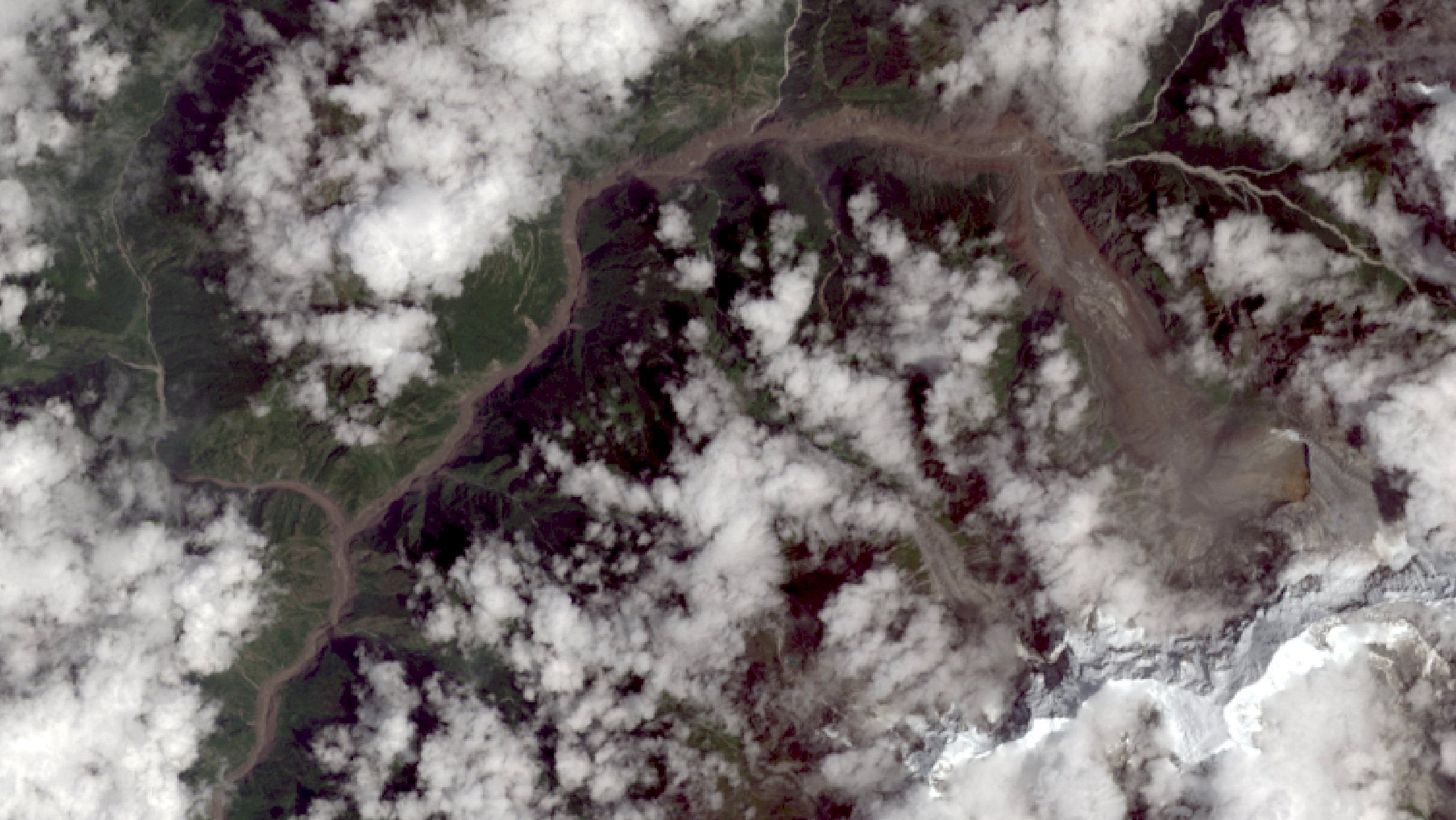 A satellite view shows collapsed glaciers that, according to an expert, may have triggered flash floods and a mudslide in Langtang, Nepal on Wednesday. Photo: USGS/Landsat 9/Handout via Reuters
