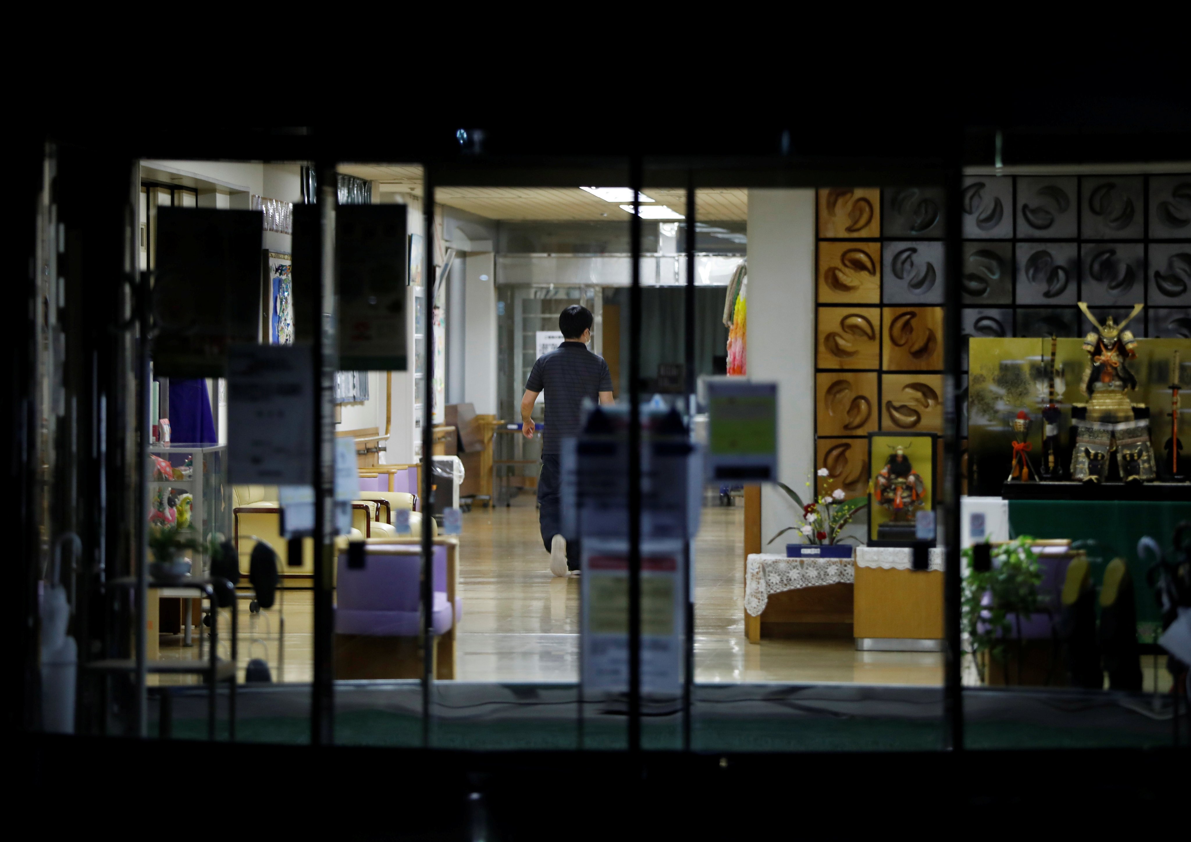 A staff member is seen inside an elderly care home in Tokyo, Japan, in 2020. Photo: Reuters