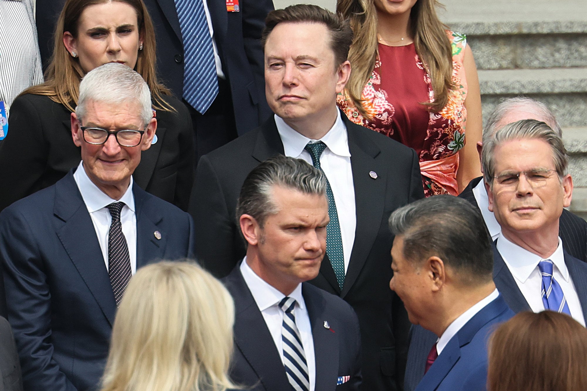 American executives including Apple CEO Tim Cook (left) and Tesla chief Elon Musk (centre) travelled to Beijing in May as part of Donald Trump’s delegation. Photo: AP American executives including Apple CEO Tim Cook (left) and Tesla chief Elon Musk (centre) travelled to Beijing in May as part of Donald Trump’s delegation. Photo: AP