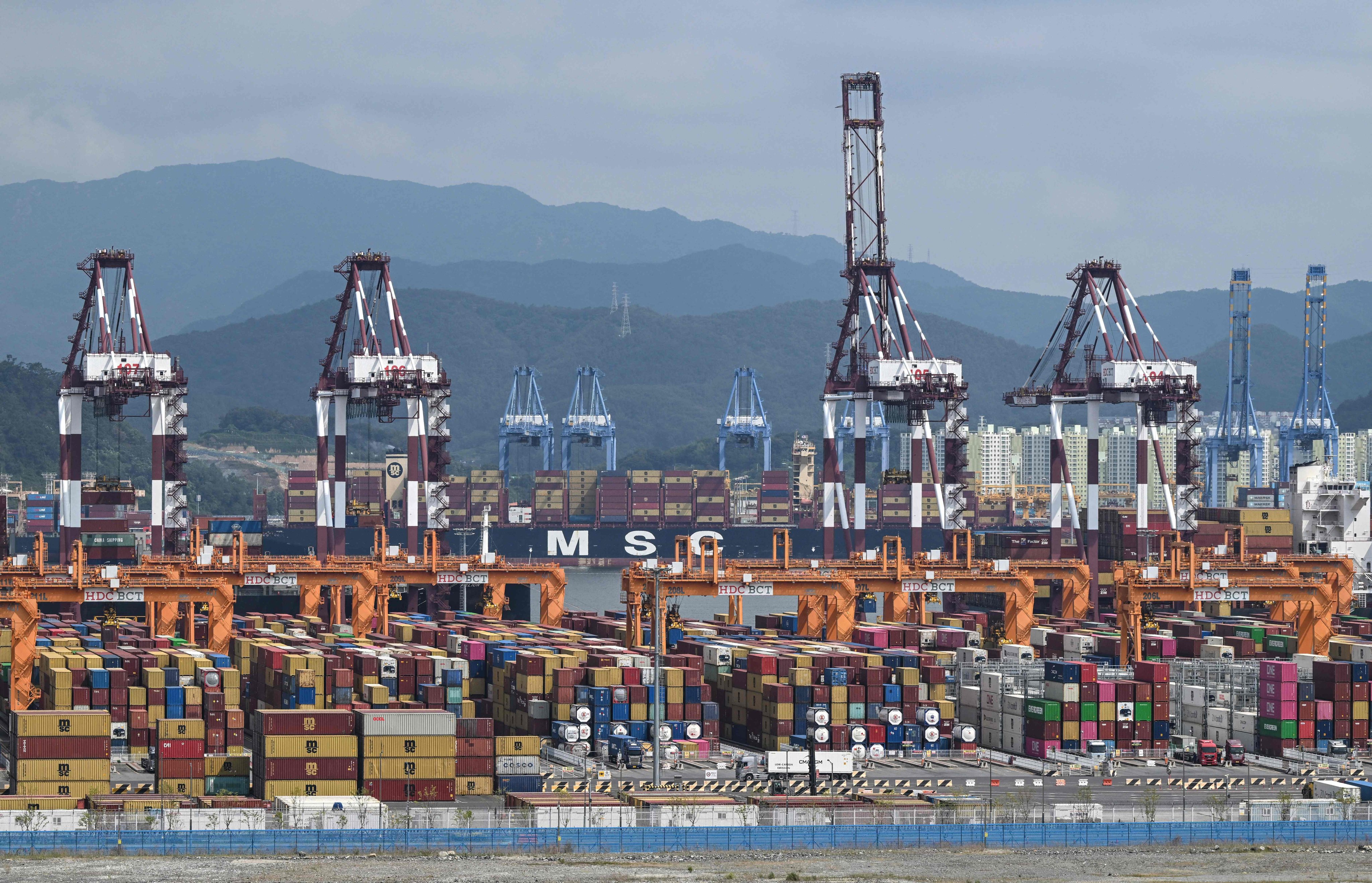 Shipping containers and cranes at Busan New Port in Busan on August 22. South Korea’s economy is forecast to grow 3.3 per cent in 2026. Photo: AFP