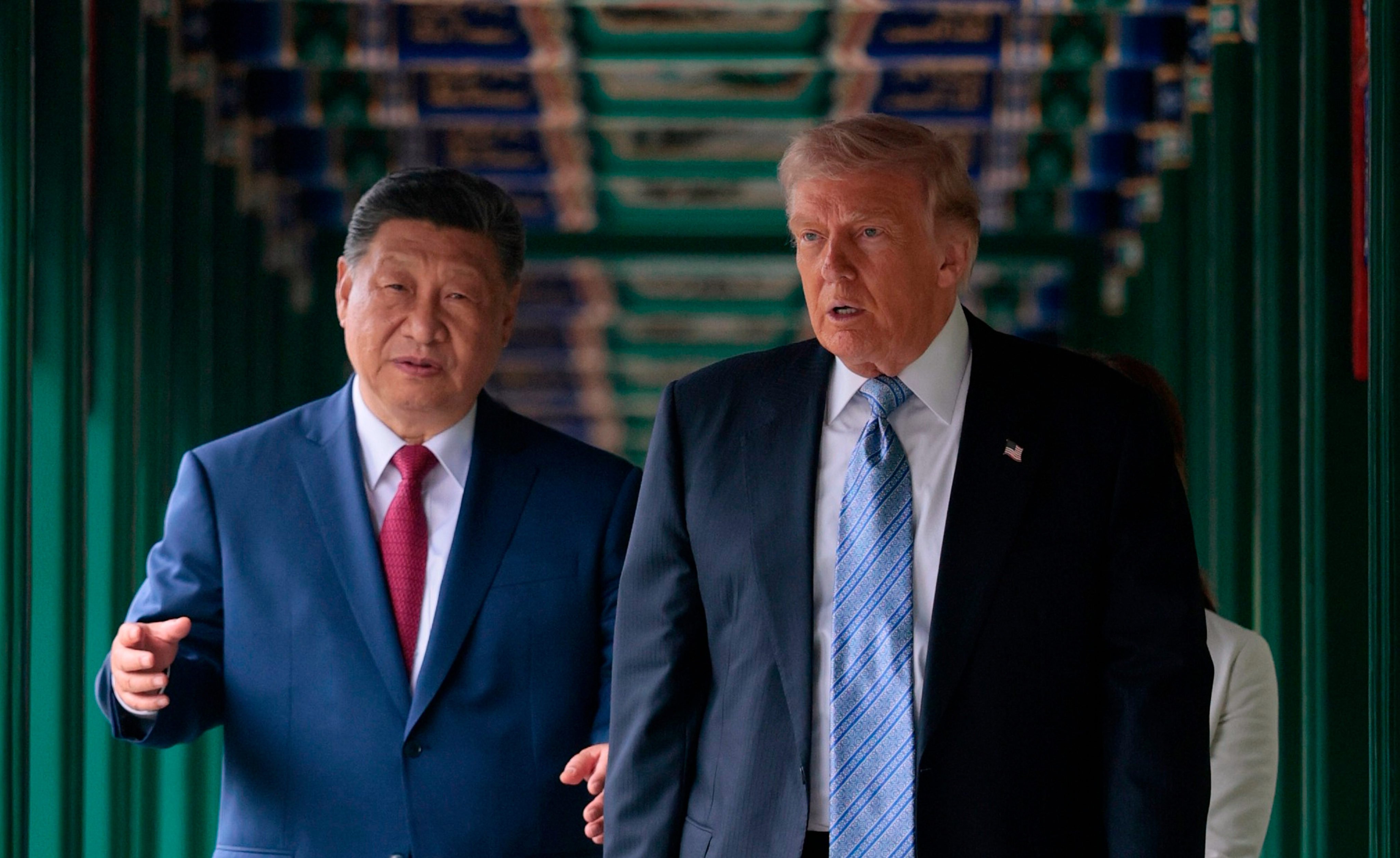 US President Donald Trump (right) walks with President Xi Jinping in Beijing on May 15. Photo: Evan Vucci/Pool via AP