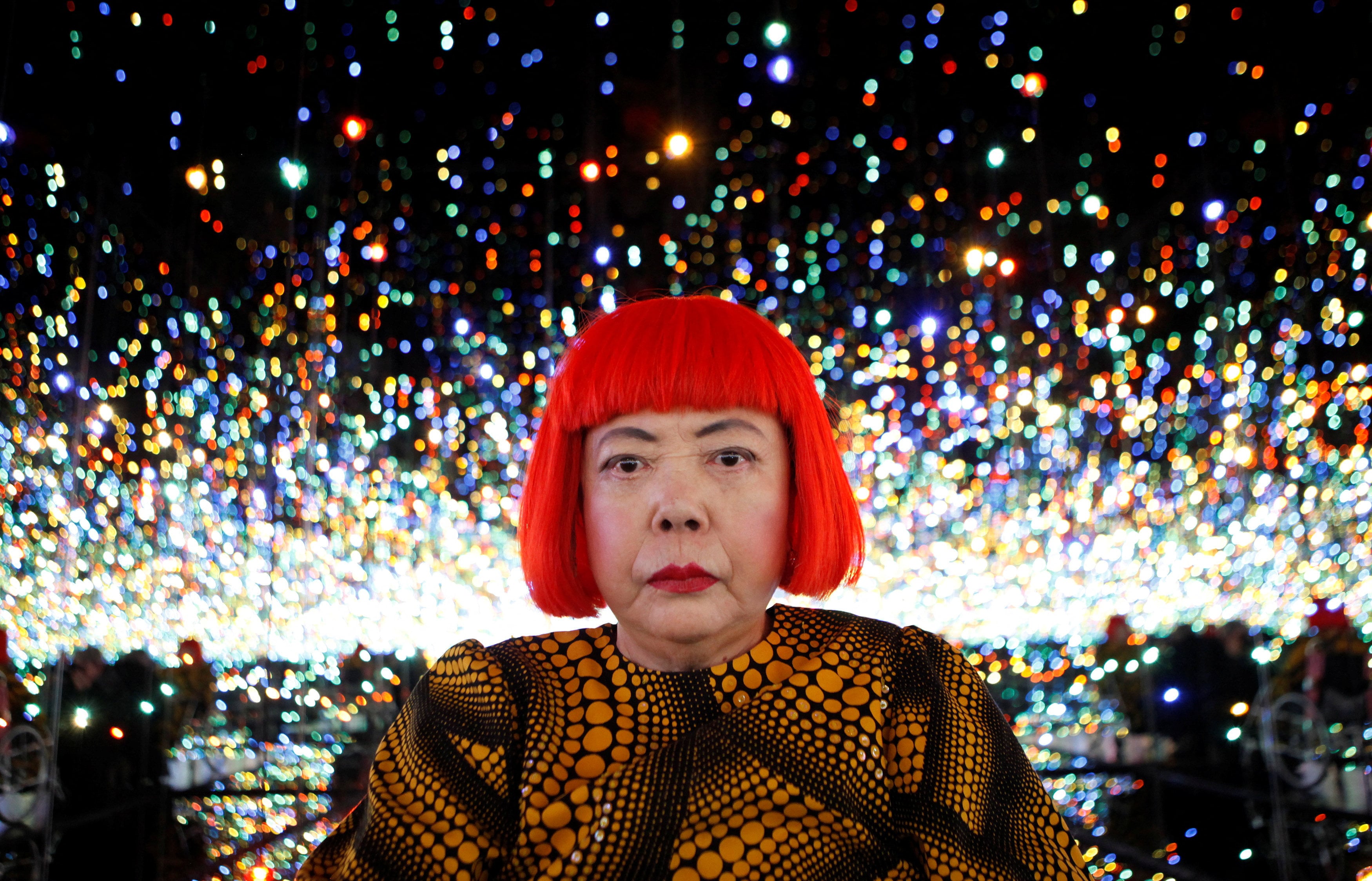 Kusama inside her Infinity Mirrored Room installation titled “The Souls of Millions of Light Years Away” (2013) during a media preview of her exhibition at the David Zwirner gallery in New York on November 7, 2013. Photo: Reuters