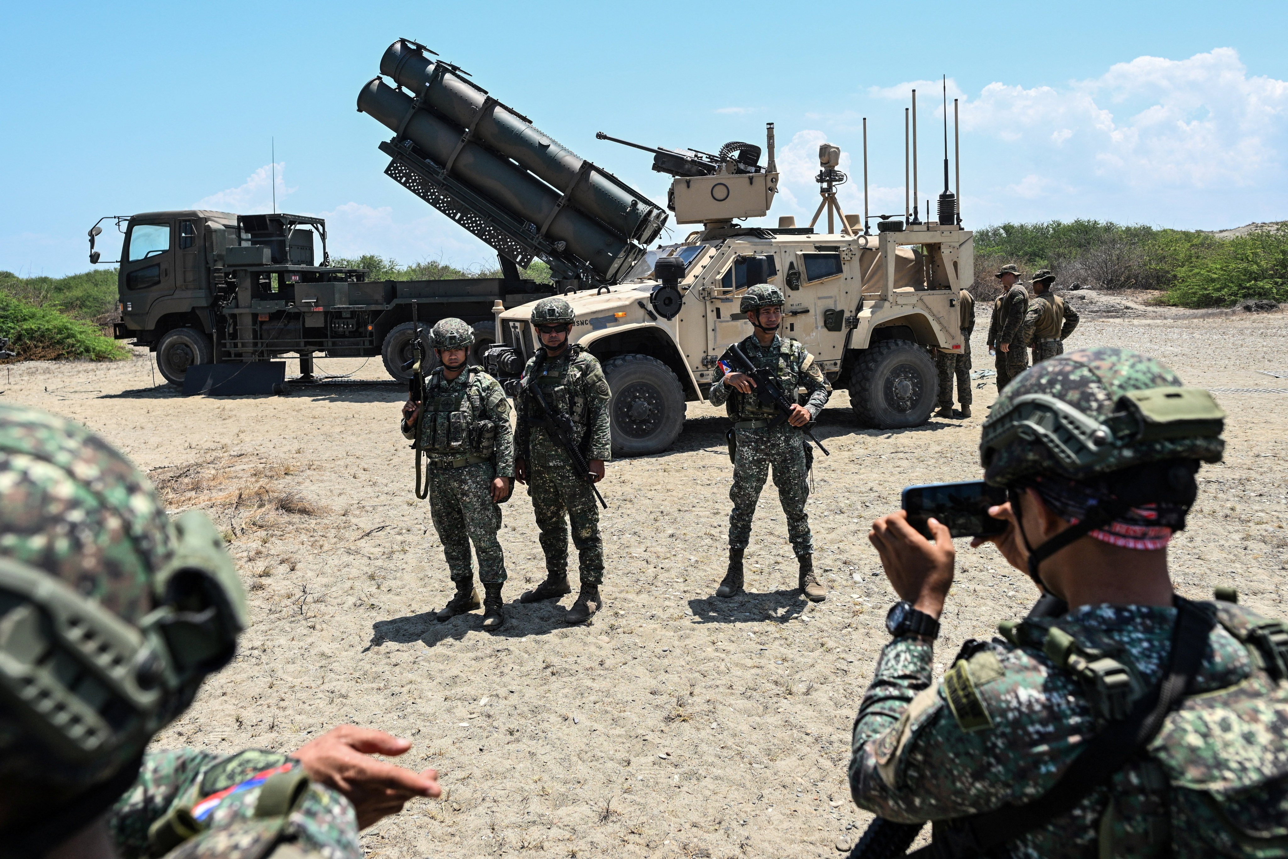 Philippine soldiers pose for a picture in front of the Japanese Type 88 surface-to-ship missile launcher during the annual Balikatan military drills between the US and the Philippines at Paoay, Ilocos Norte province, in May. Photo: Reuters
