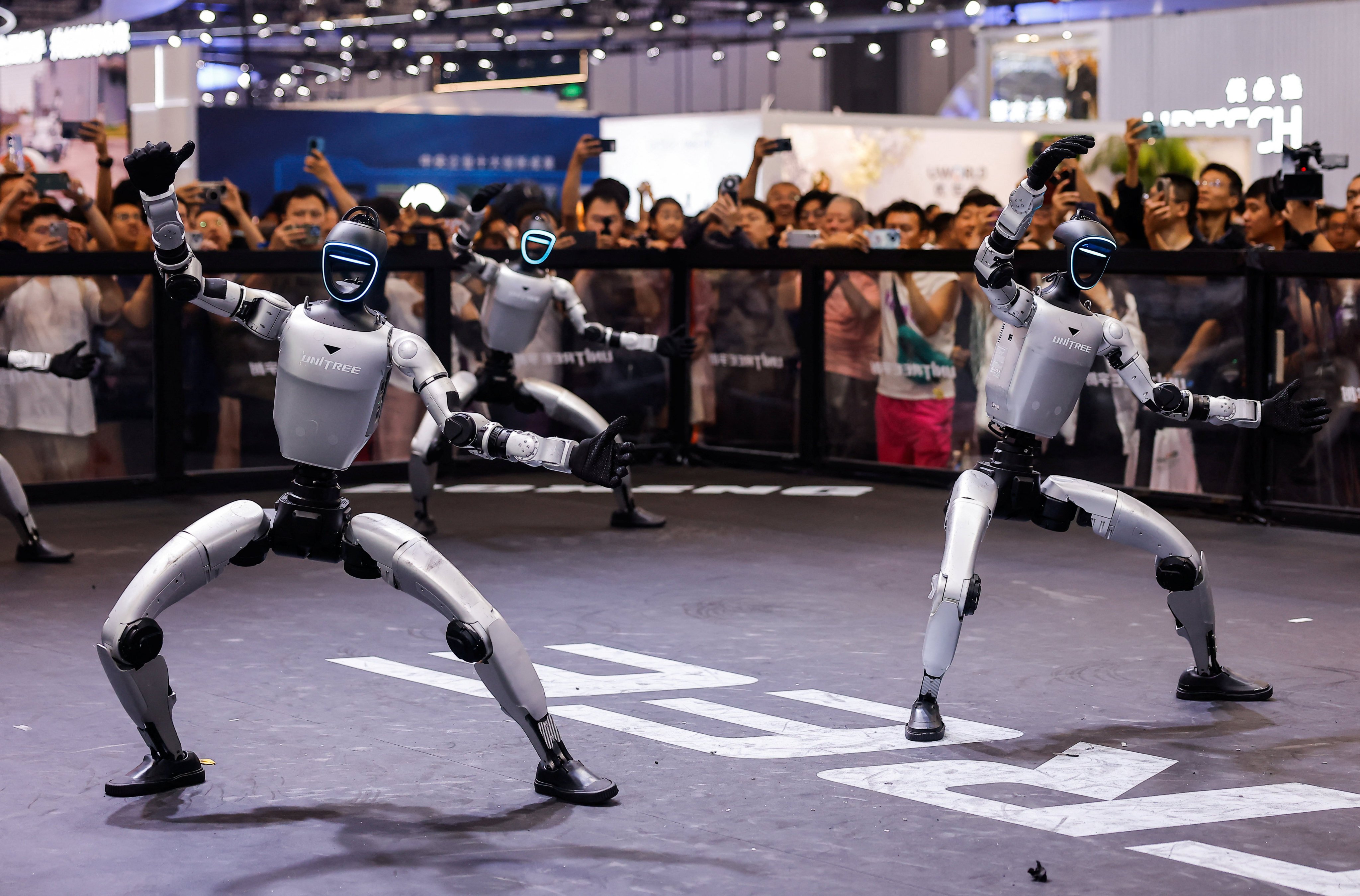 Unitree G1 robots perform at the company’s booth at the World Robot Conference in Beijing, August 20, 2026. Photo: Reuters