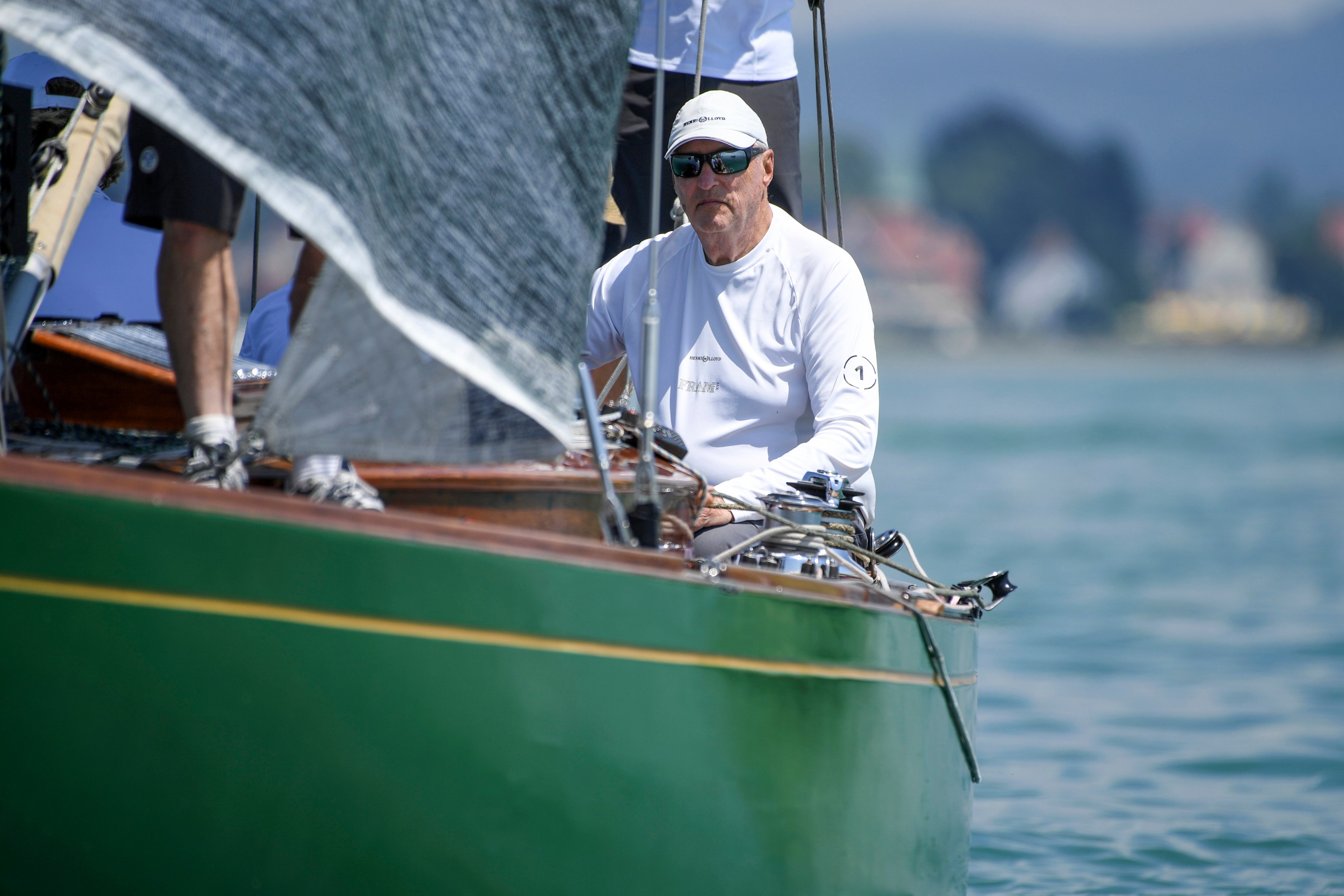 King Harald V on his boat in 2018. Photo: dpa via AP