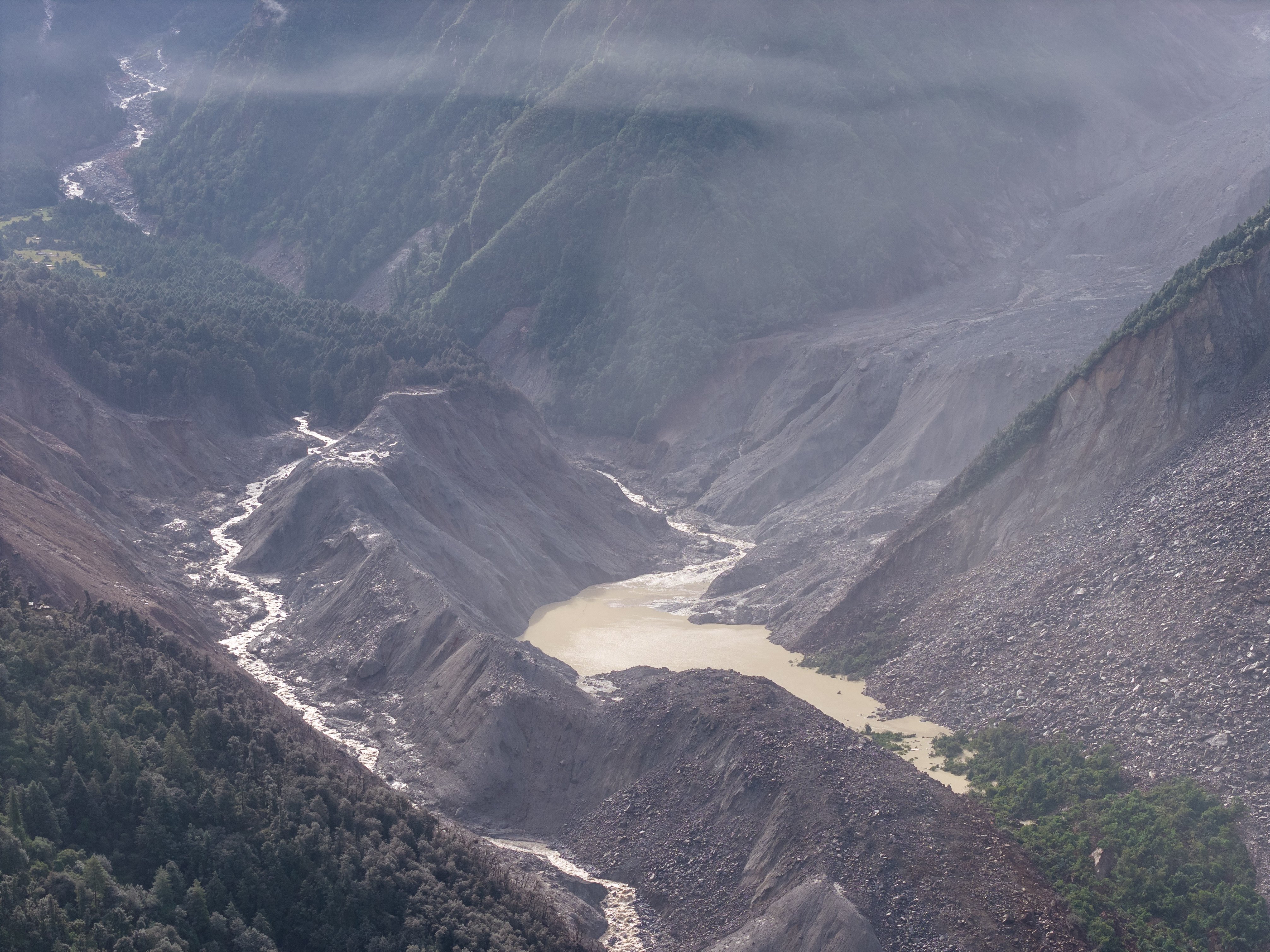 A barrier lake has formed after the debris flow from Wednesday’s mudslide in Nepal blocked a river upstream from Gyirong Port on the Chinese side of the border. Photo: Xinhua