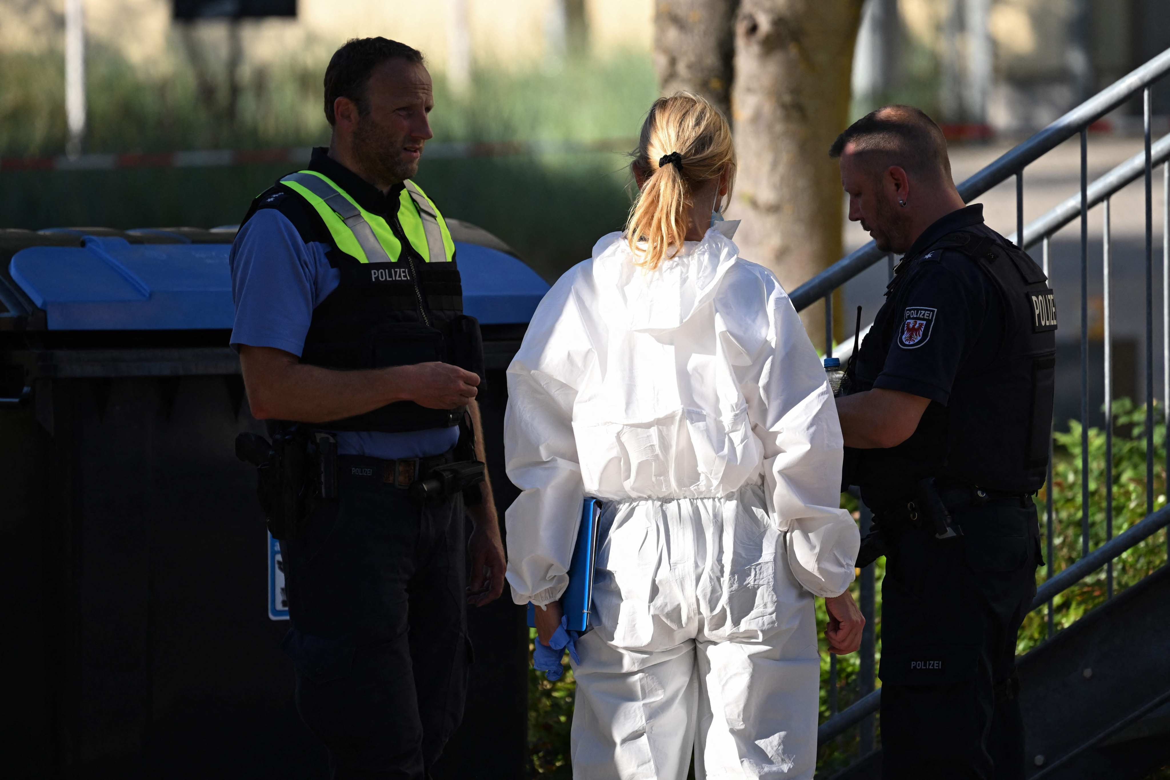 Forensic police are seen on the grounds of the private Docemus school in Gosen-Neu Zittau, southeast of Berlin, on Thursday, where two people were killed. Photo: AFP