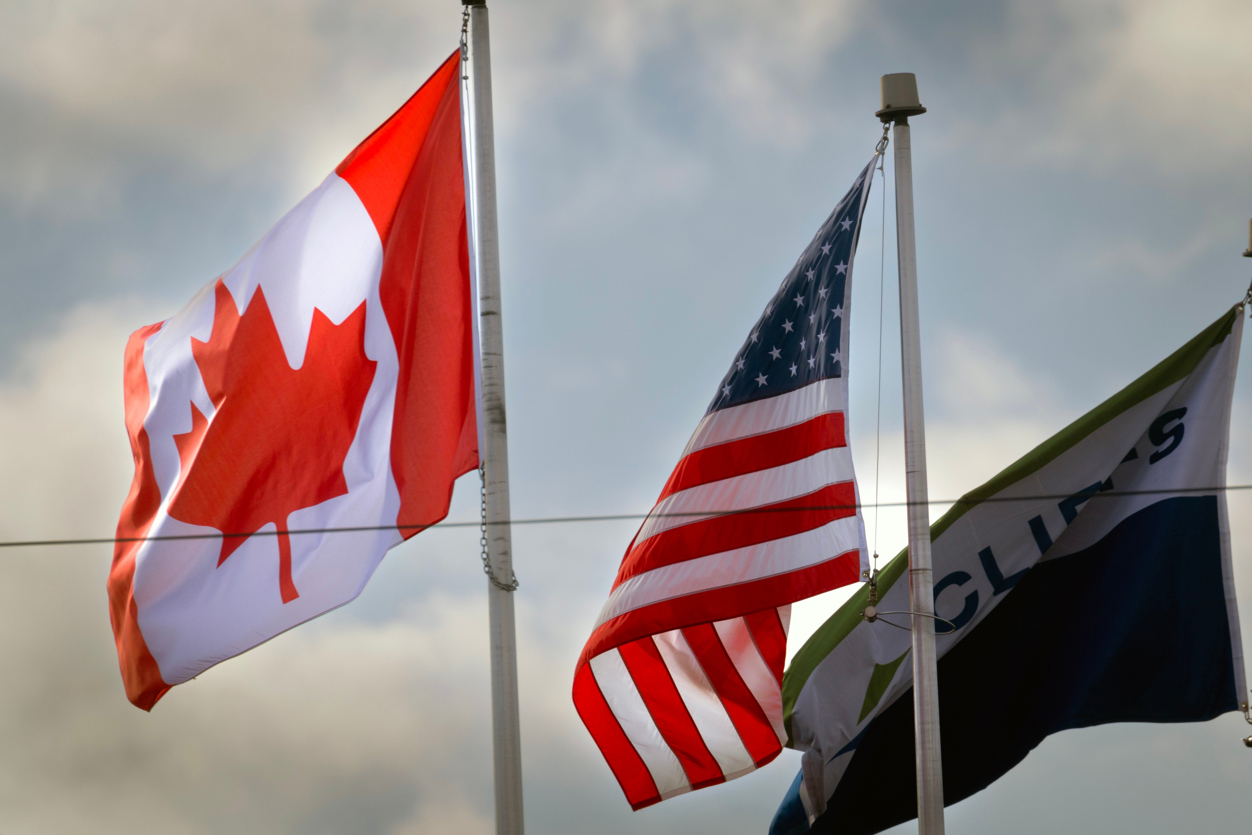 Canadian and American flags fly in Windsor, Ontario, in February 2025. Photo: TNS